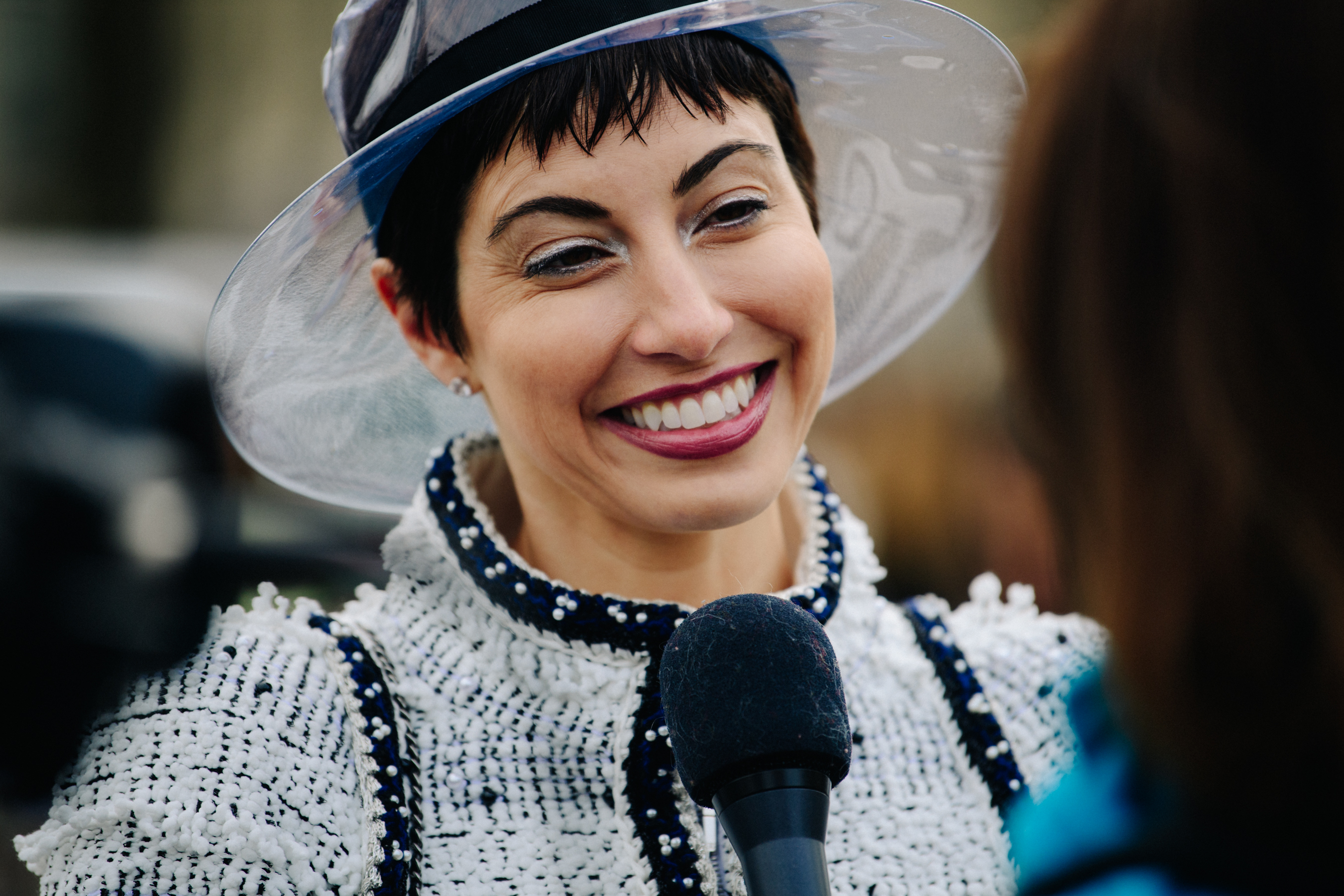 Woman wearing plastic Chanel hat