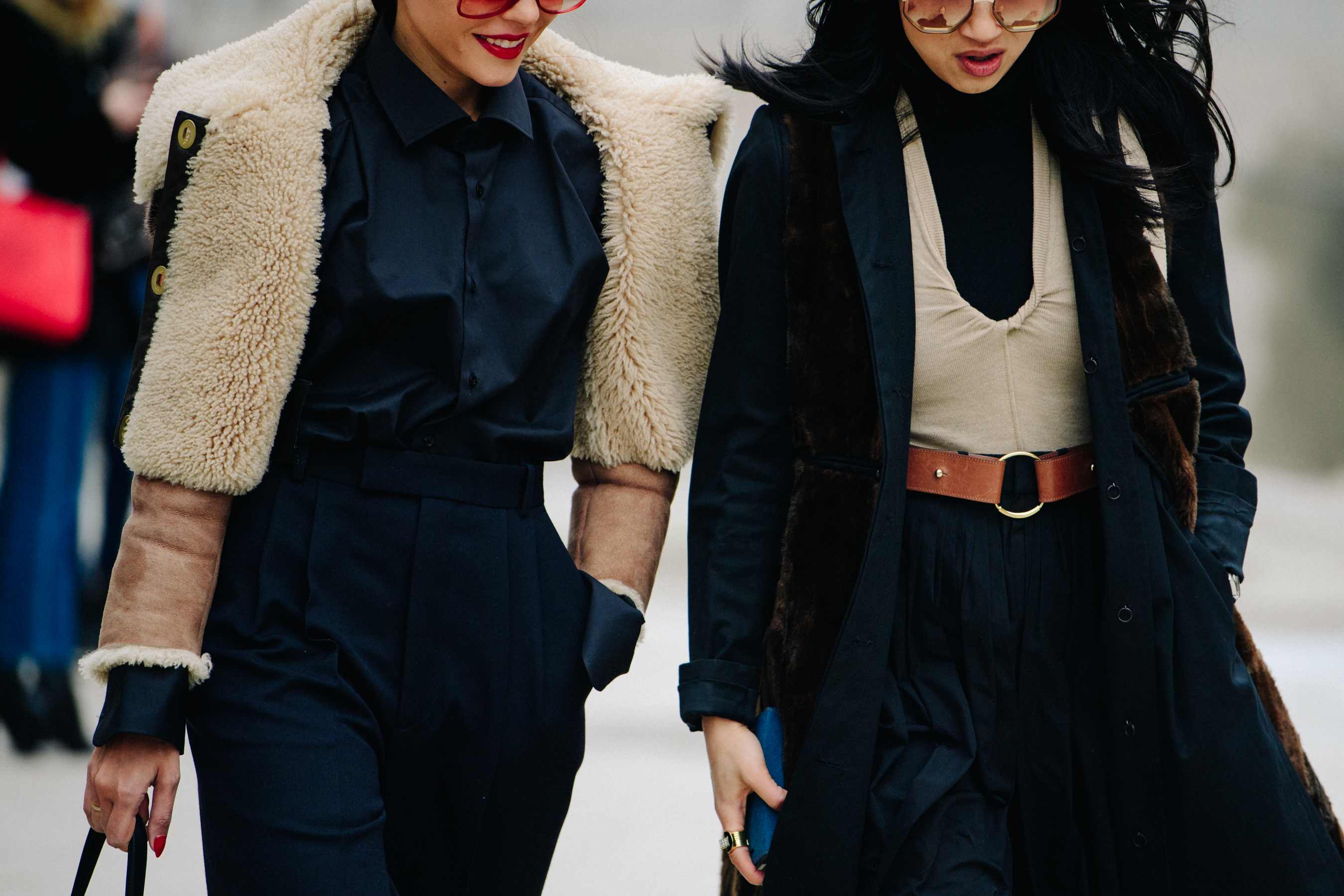 Two women wearing black and cream