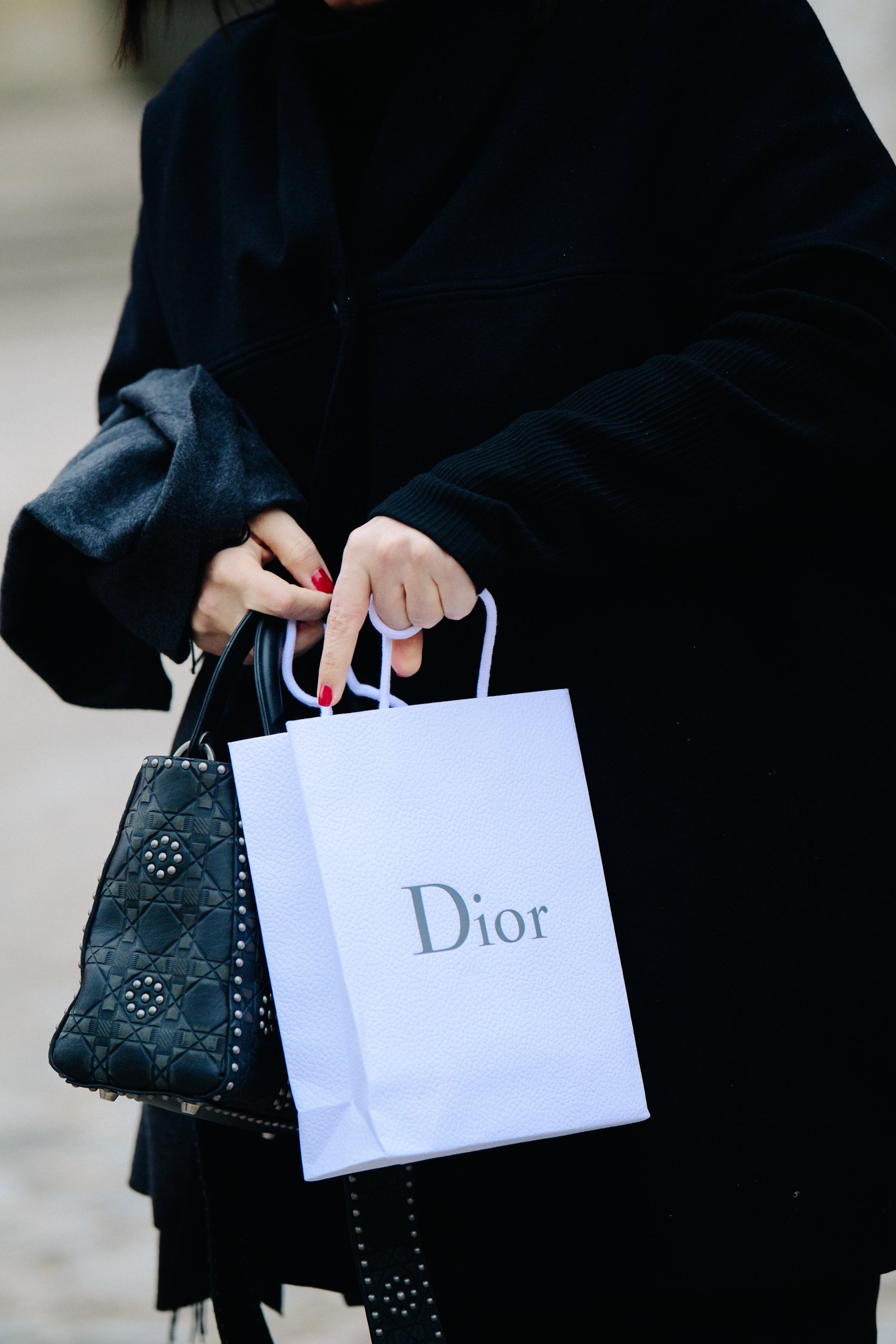 Woman carrying Dior bag