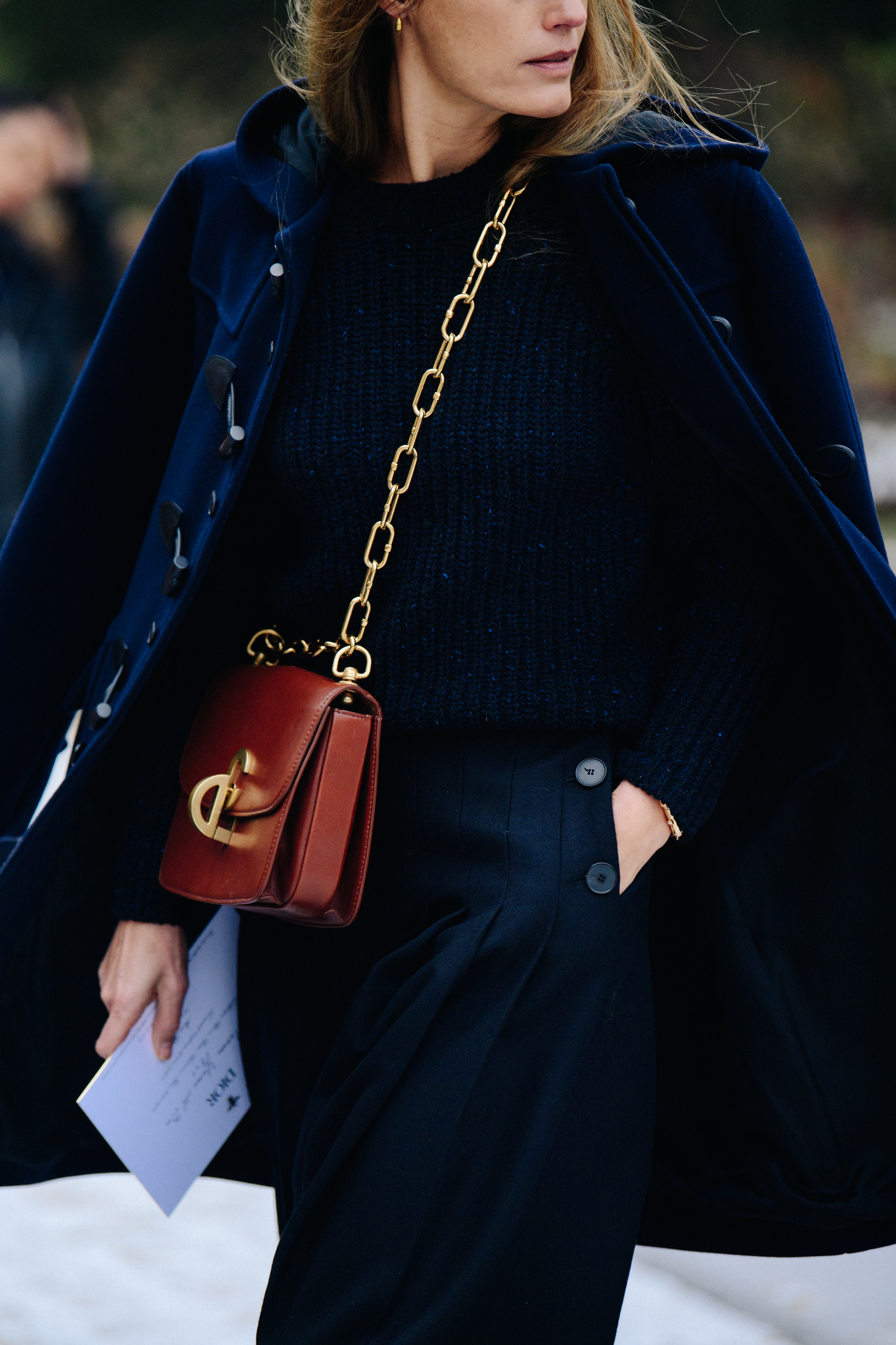 Woman wearing blue knit jumper