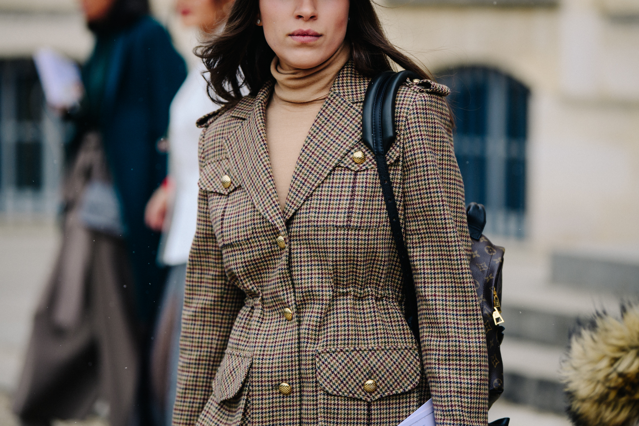 Woman wearing tweed jacket