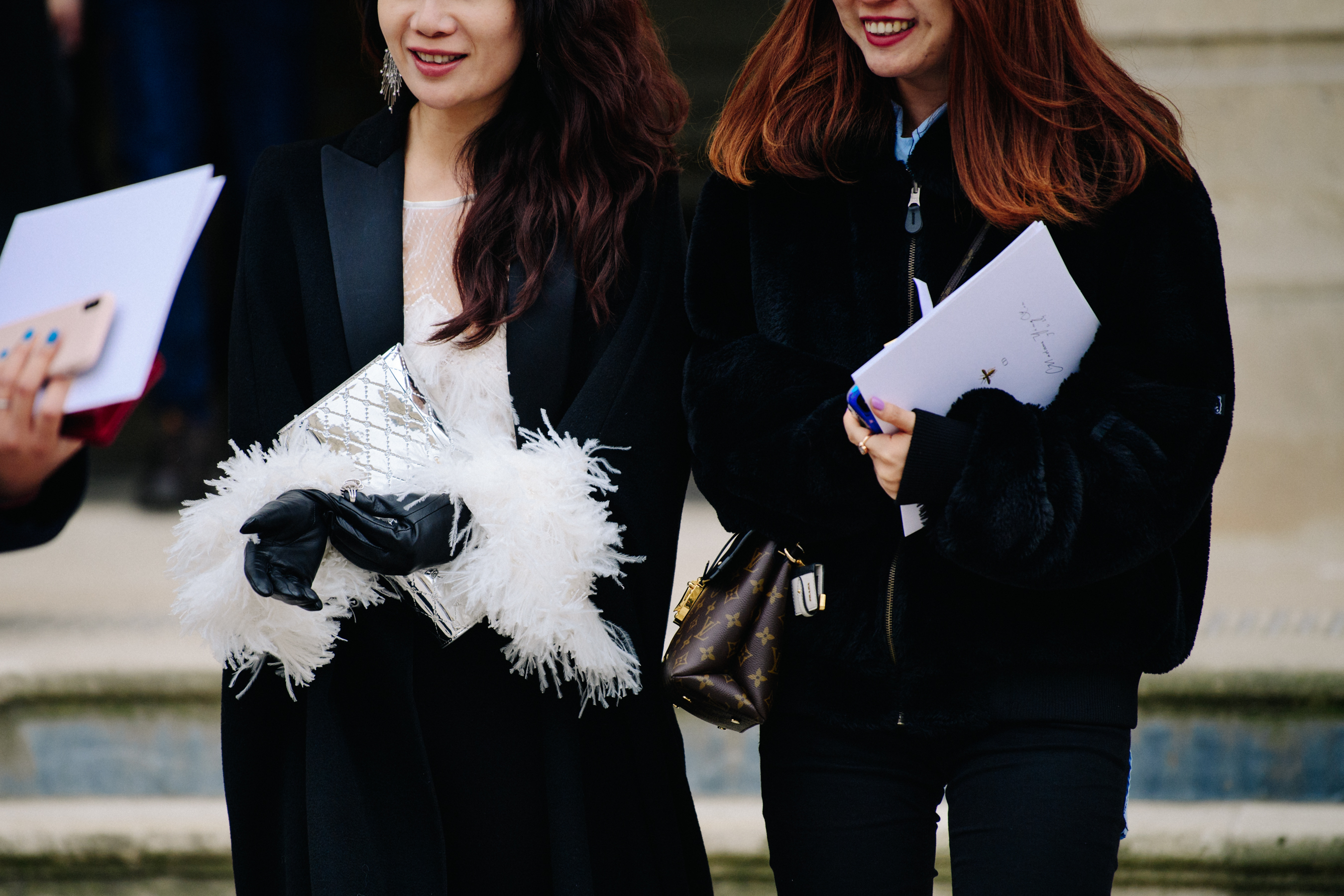 Two Asian women wearing black outfits