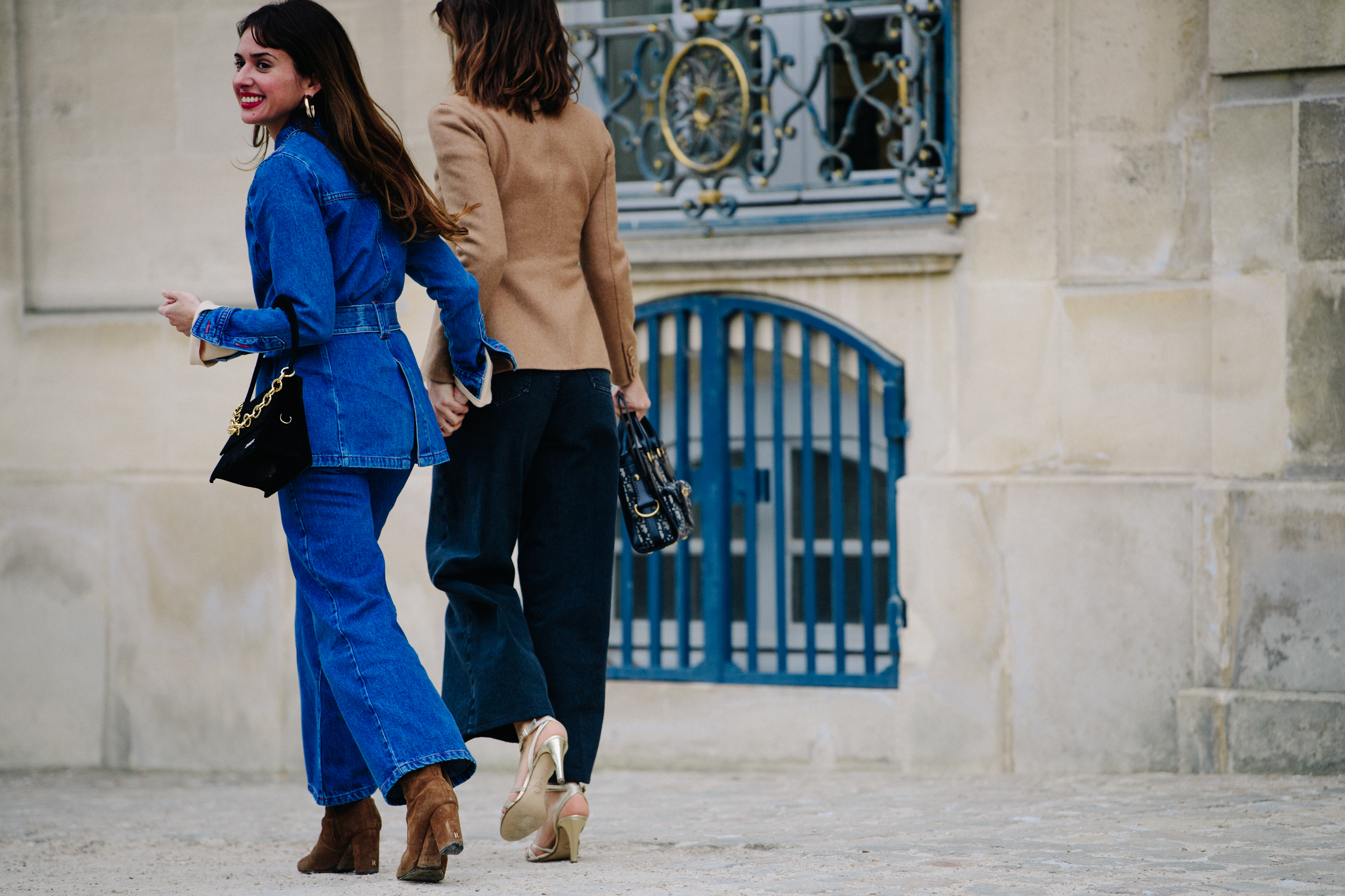 Two women wearing denim and wool