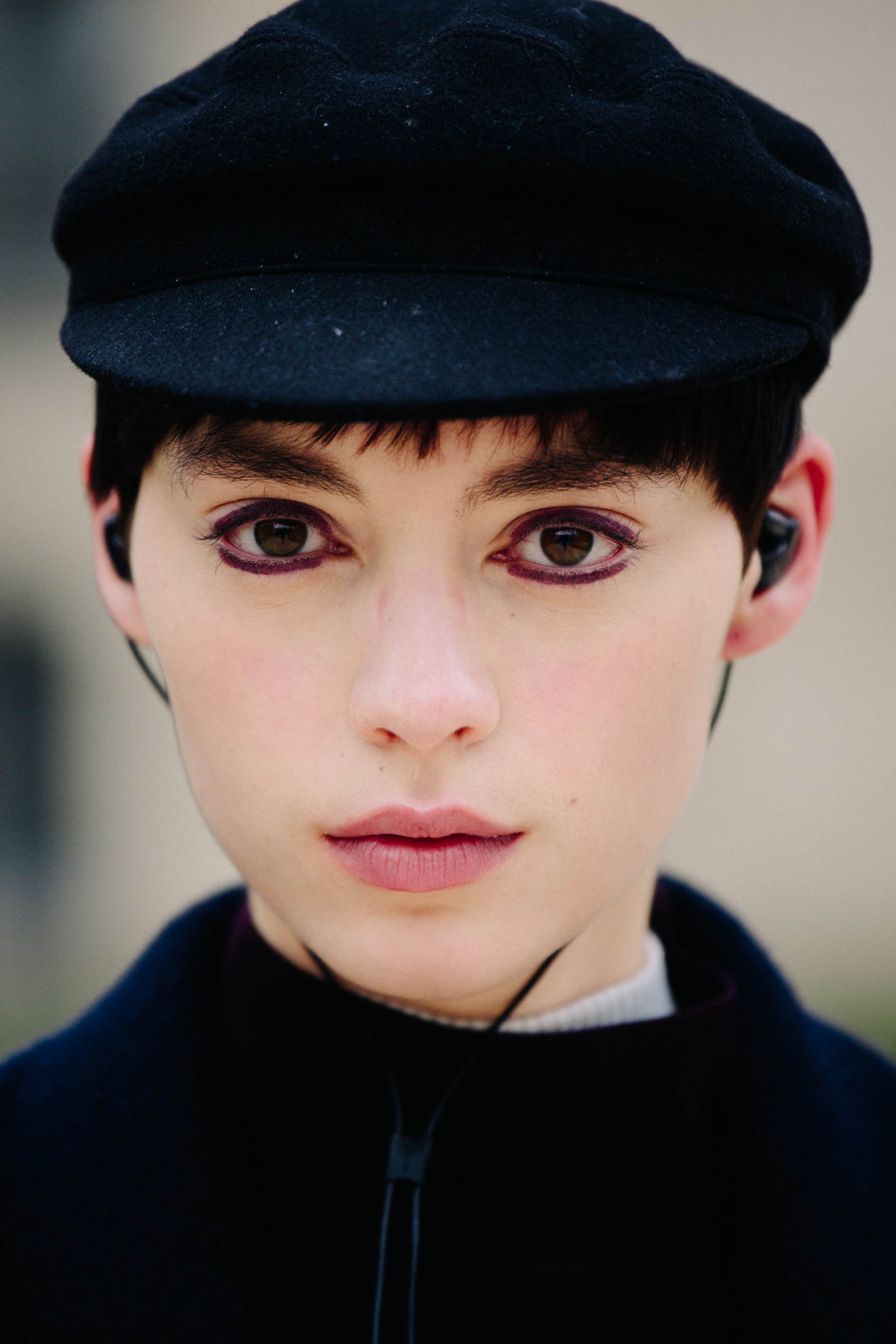 Portrait of model wearing purple eye makeup