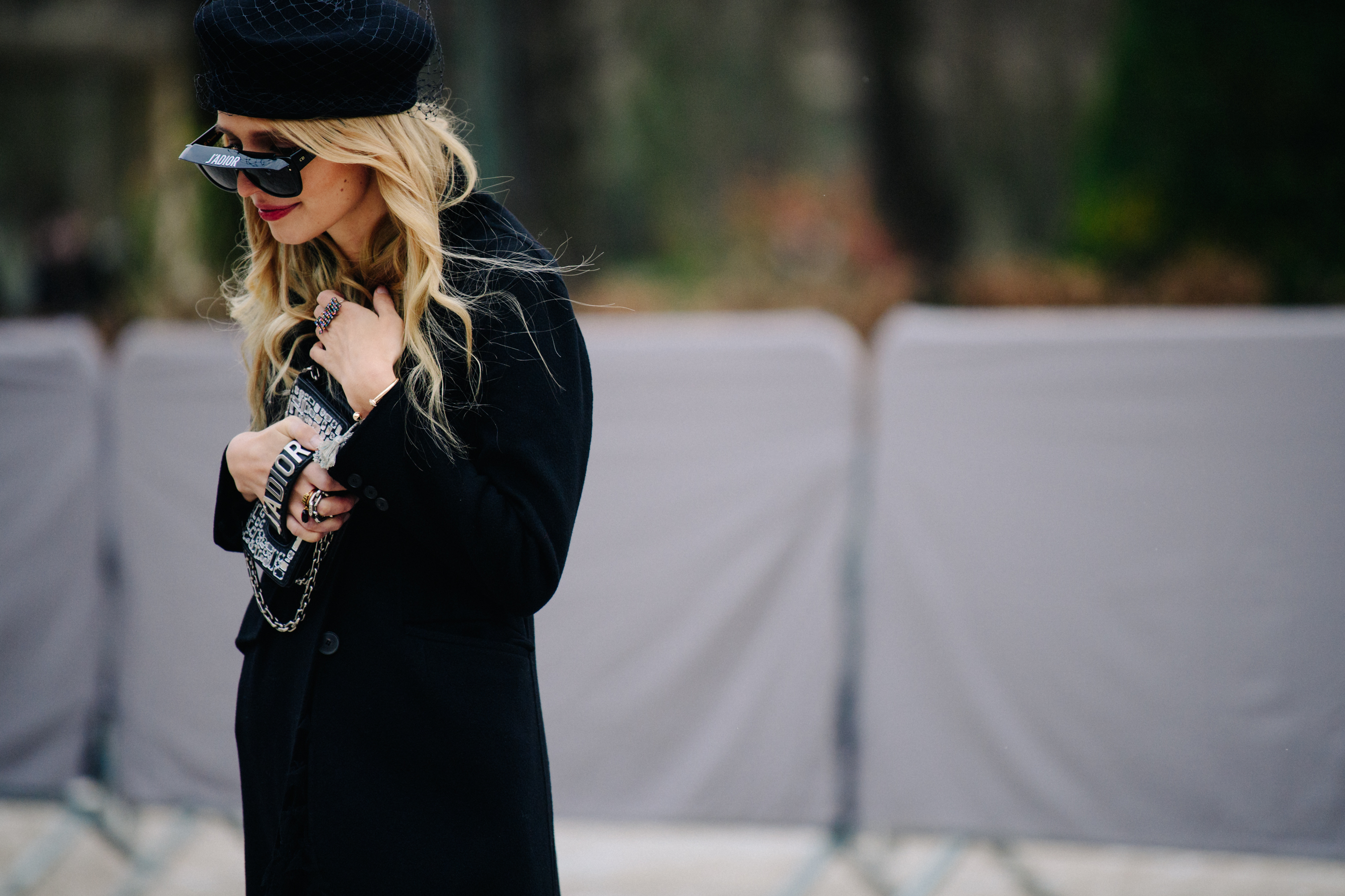 Woman wearing black Dior sunglasses