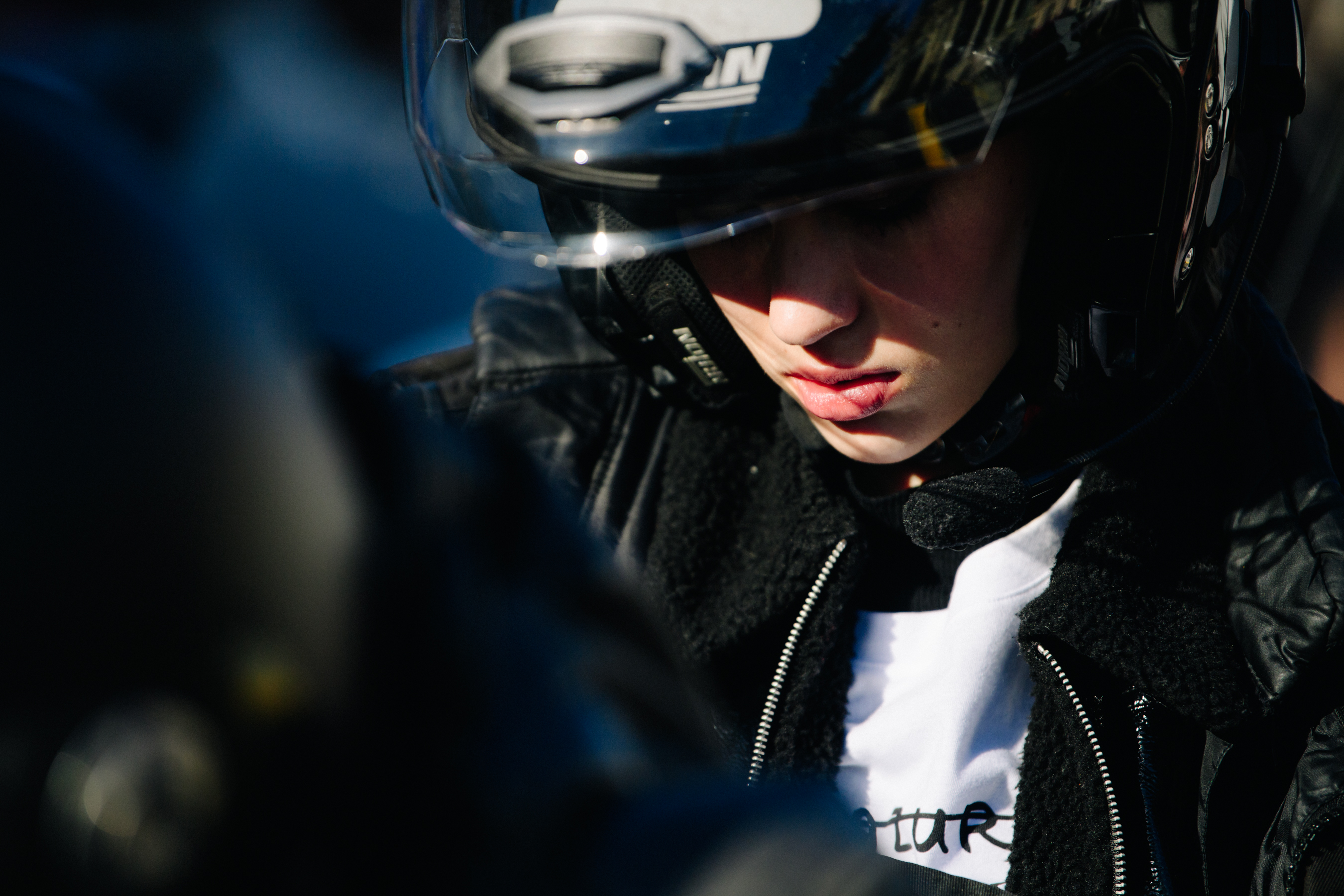 Model wearing motorcycle helmet