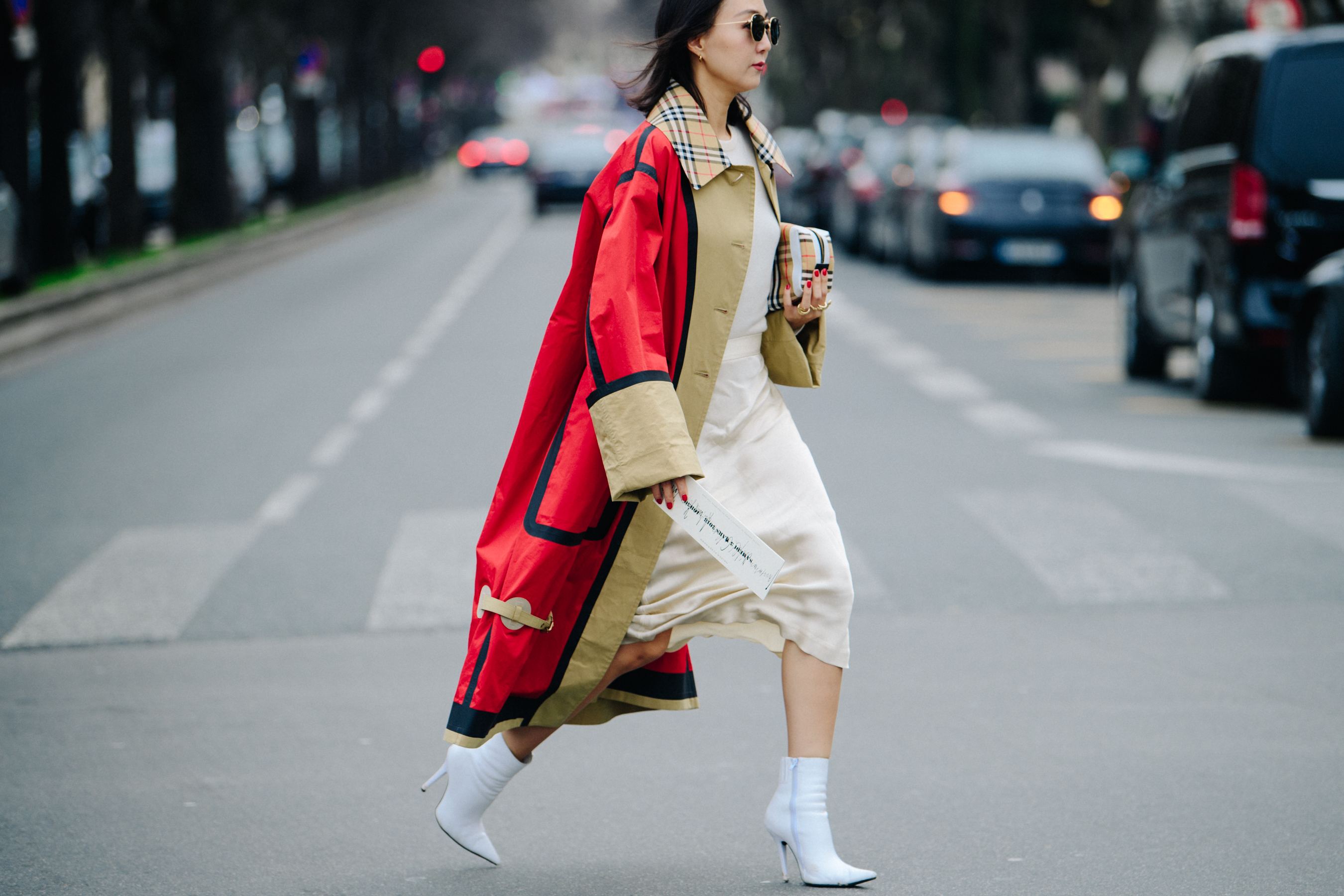 Woman wearing red and tan coat