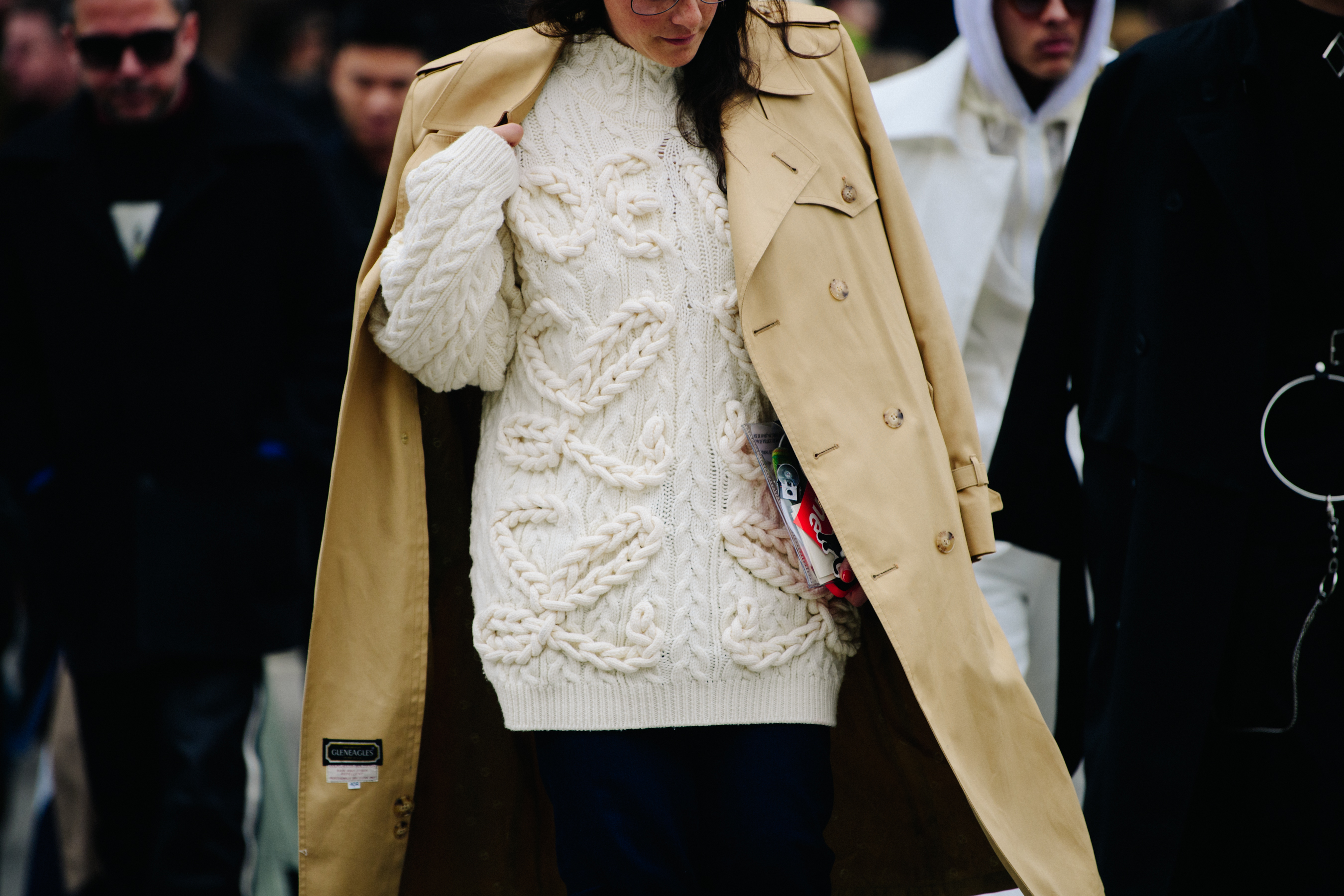 Woman wearing tan coat