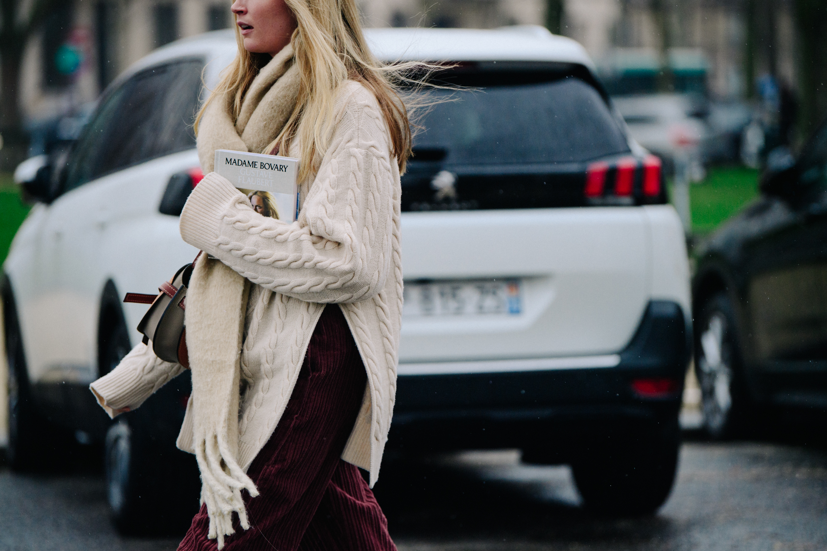 Woman wearing white knit jumper