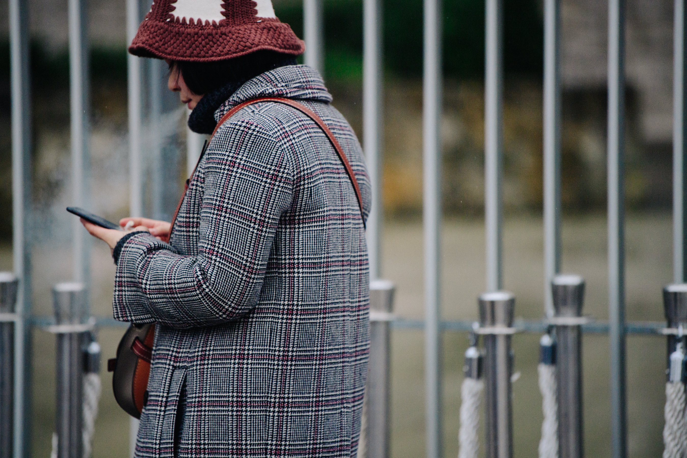 Asian woman wearing check wool coat