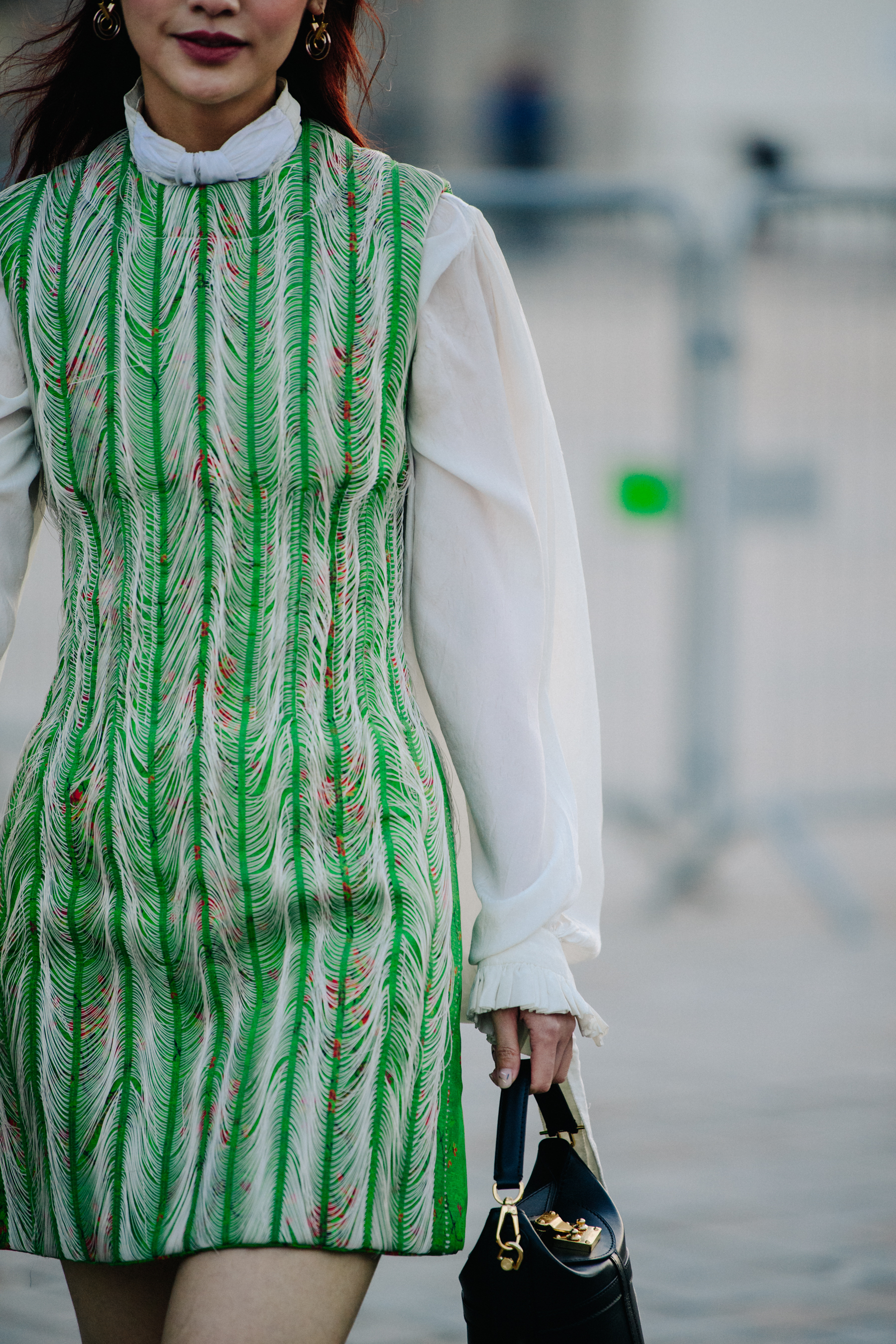 Woman wearing green and white dress