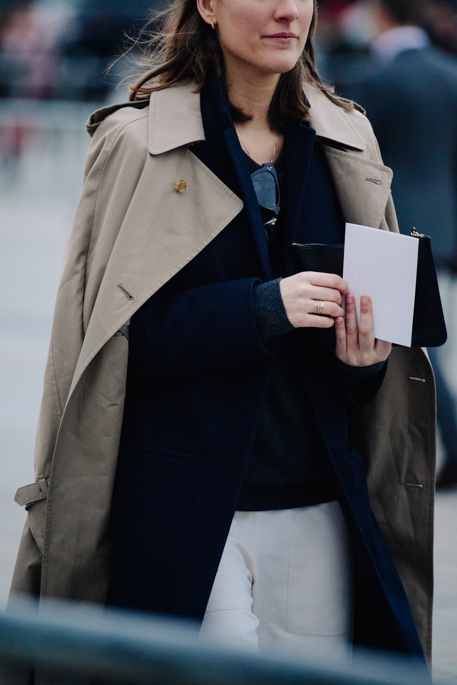 Woman wearing light tan coat