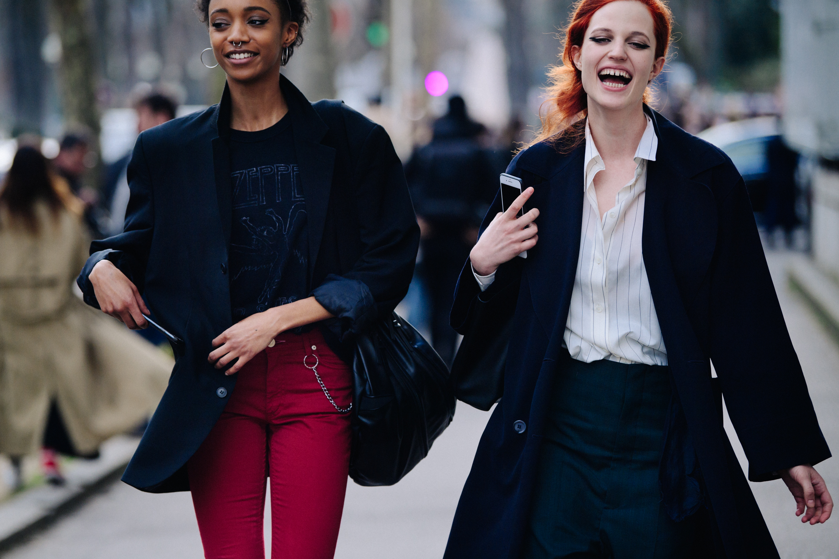 Two models wearing dark navy coats