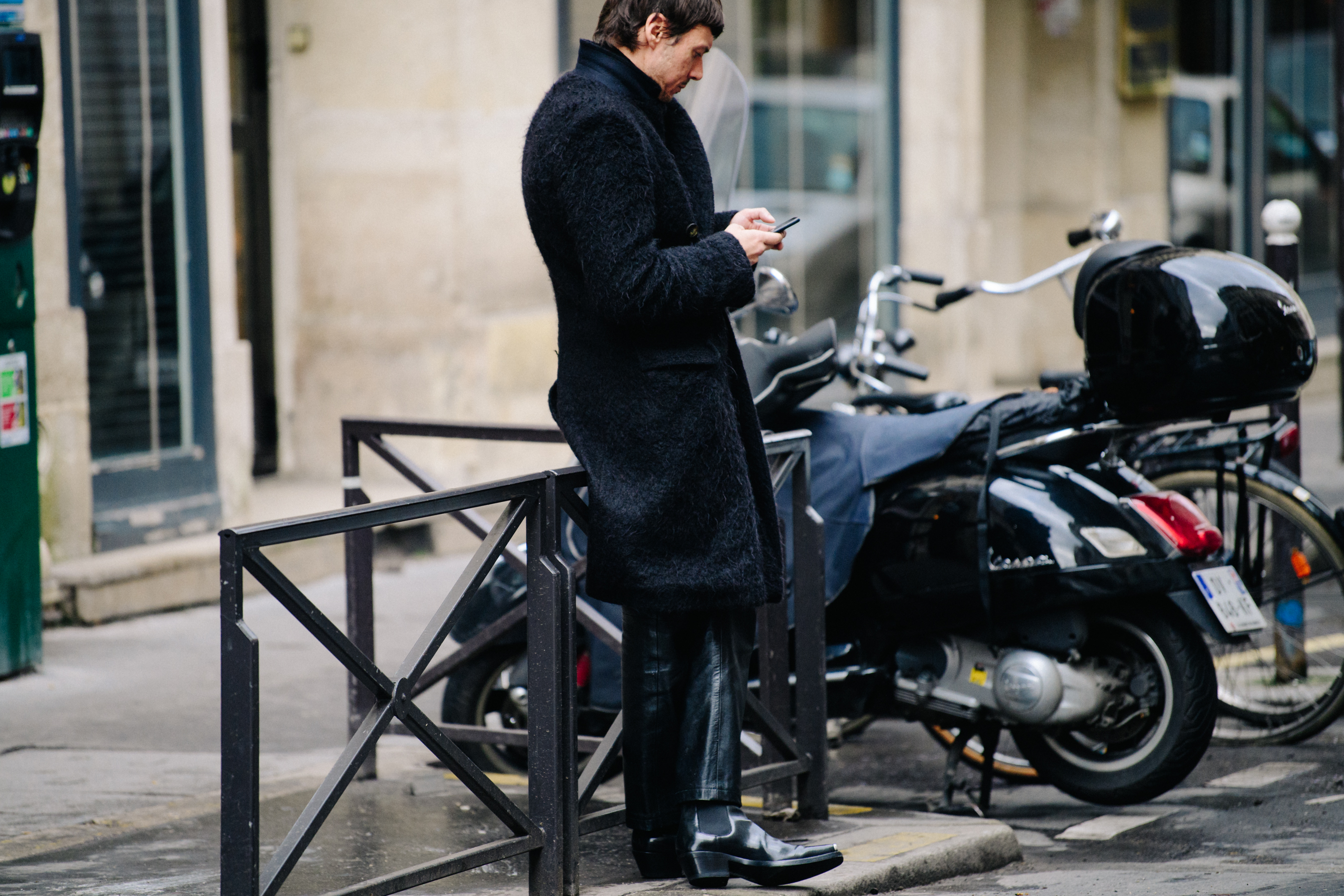 Man wearing black wool coat