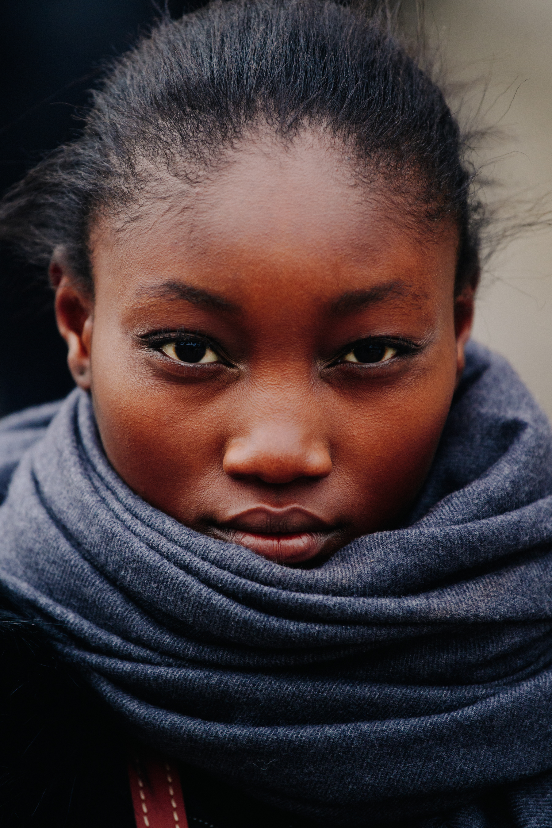 Portrait of model wearing grey scarf