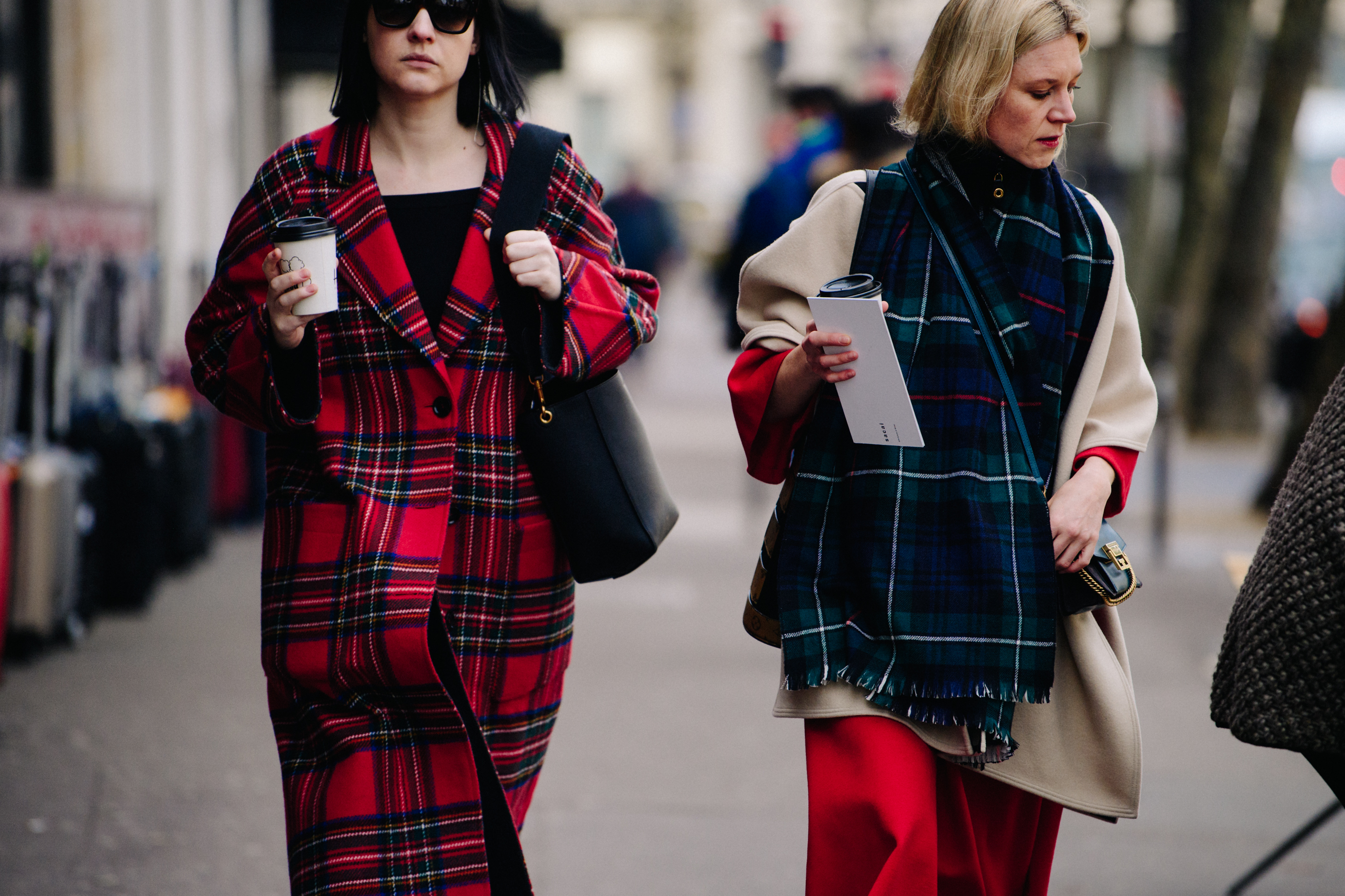 Two women wearing tartan patterns