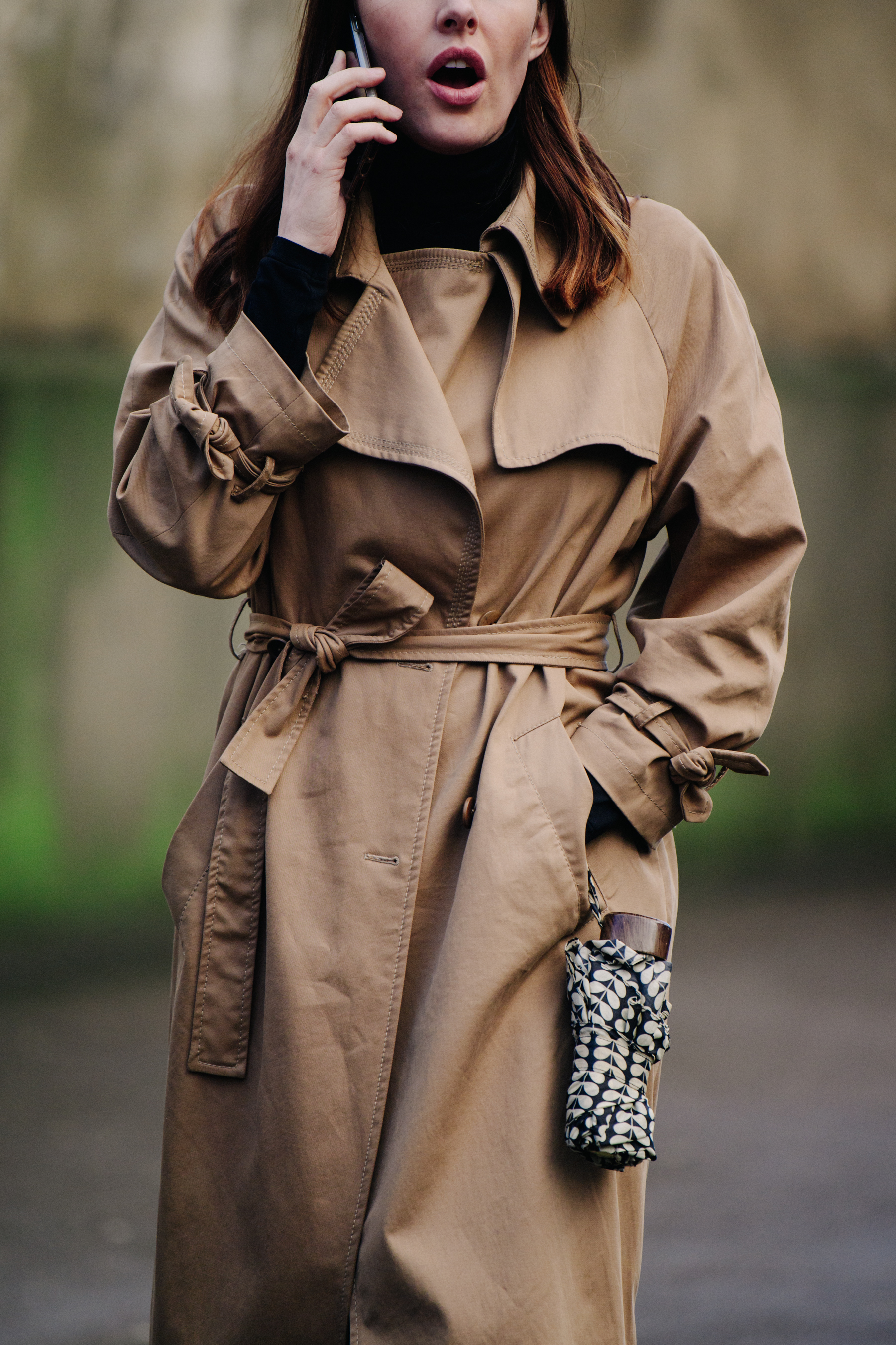 Woman wearing tan coat