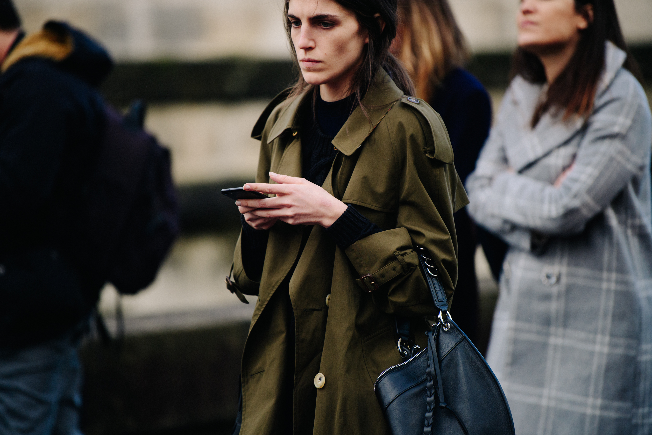 Woman wearing green overcoat