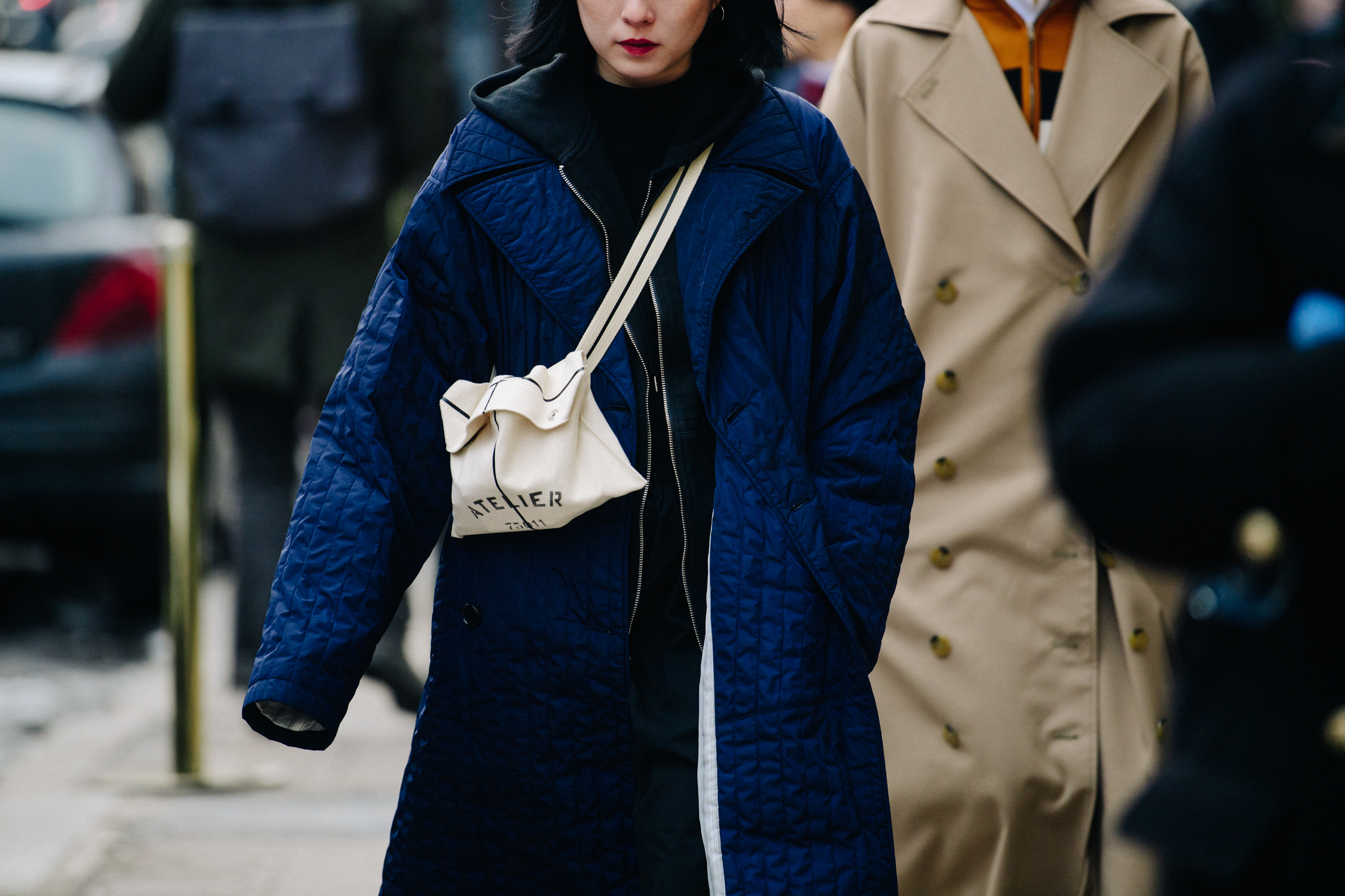 Woman wearing long blue coat