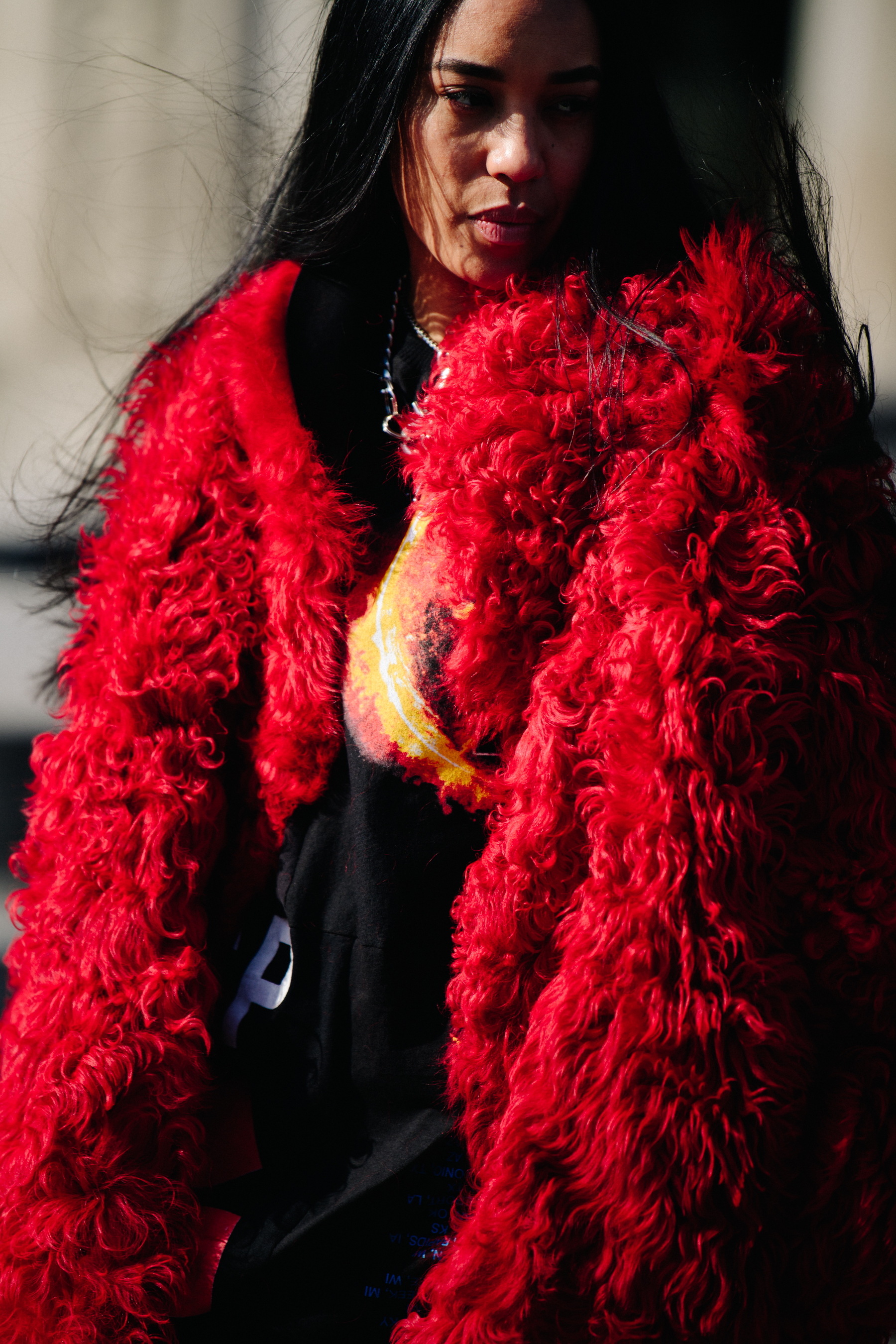 Woman wearing thick red fur coat