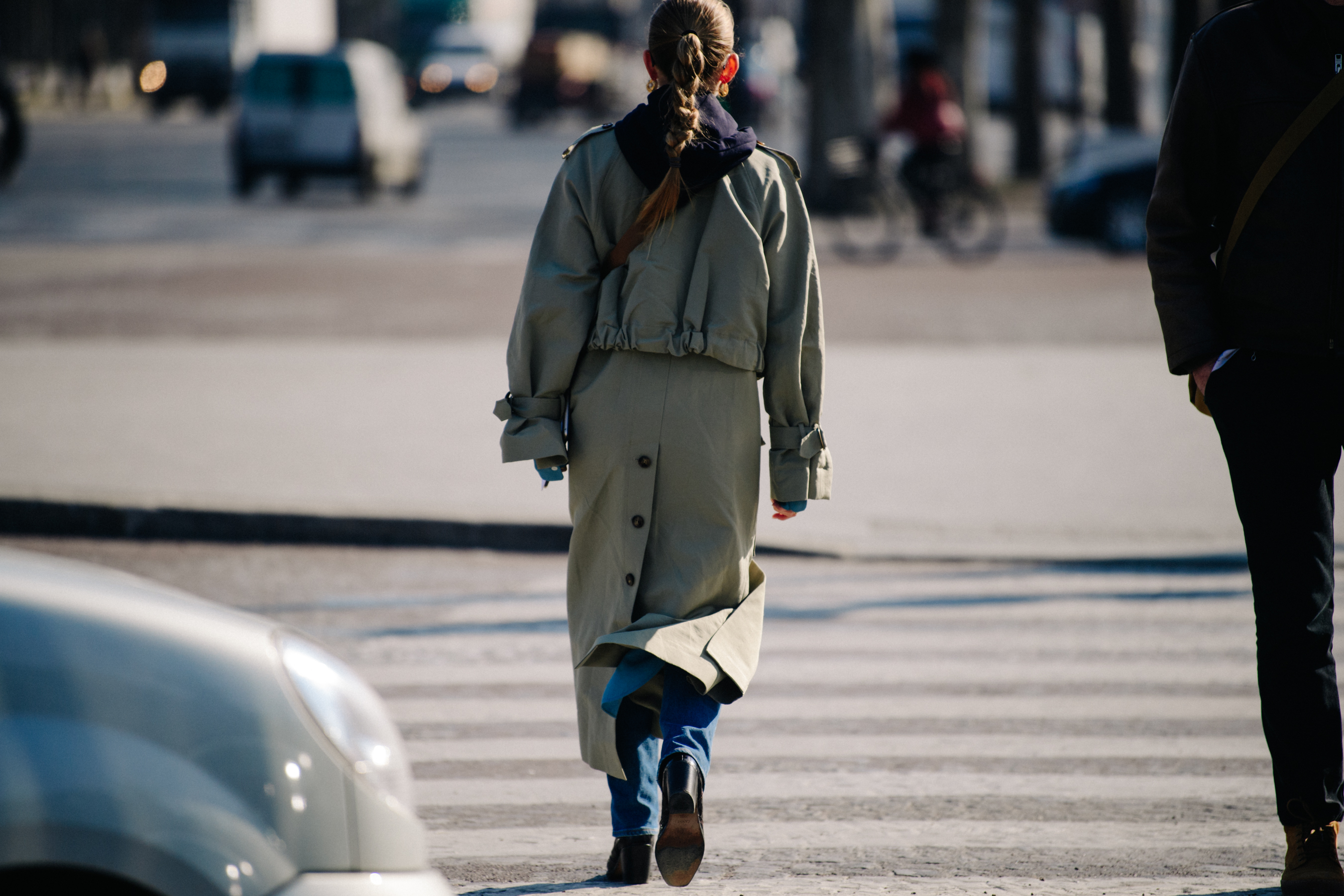 Woman wearing long pale coat