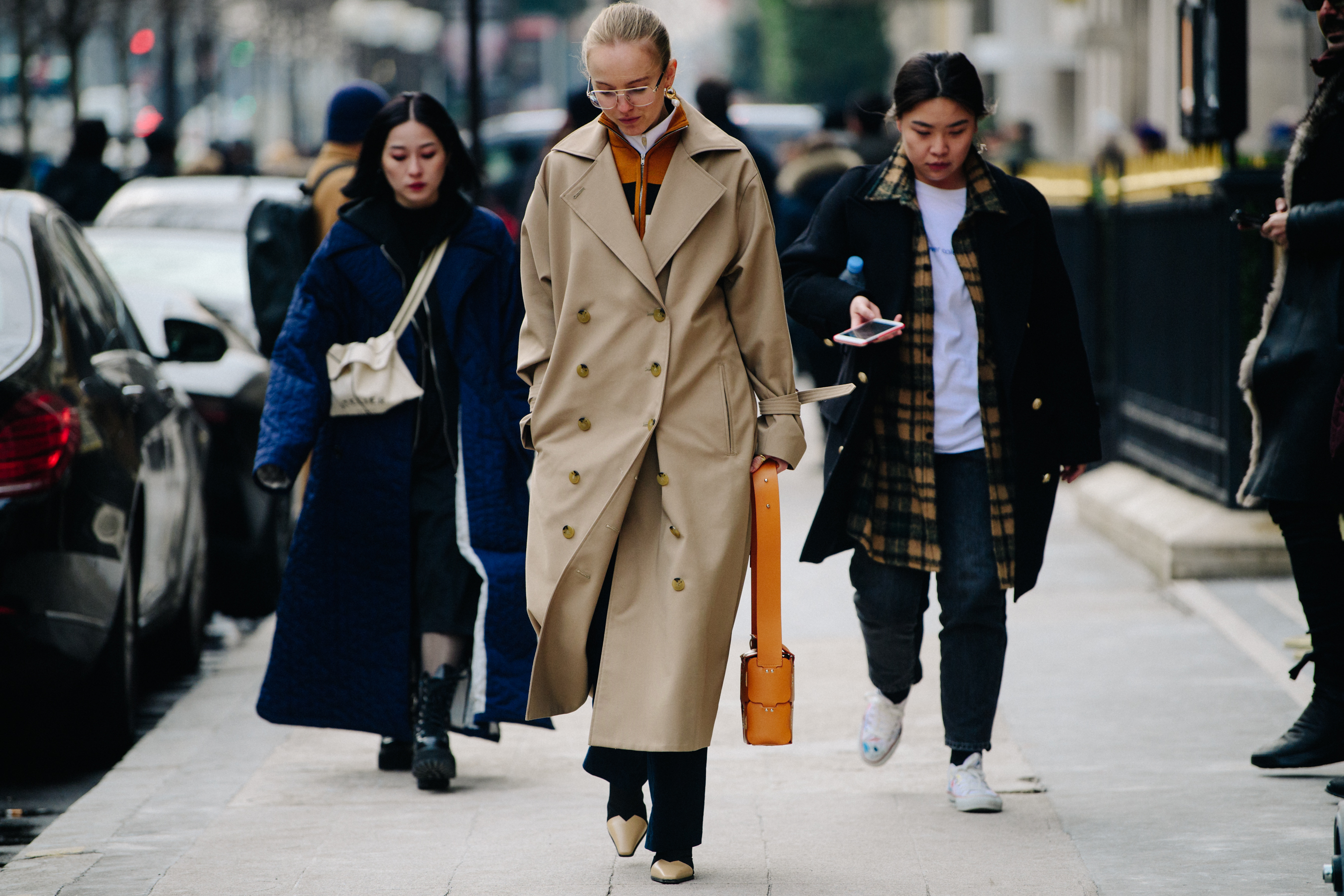 Danish woman wearing long tan coat