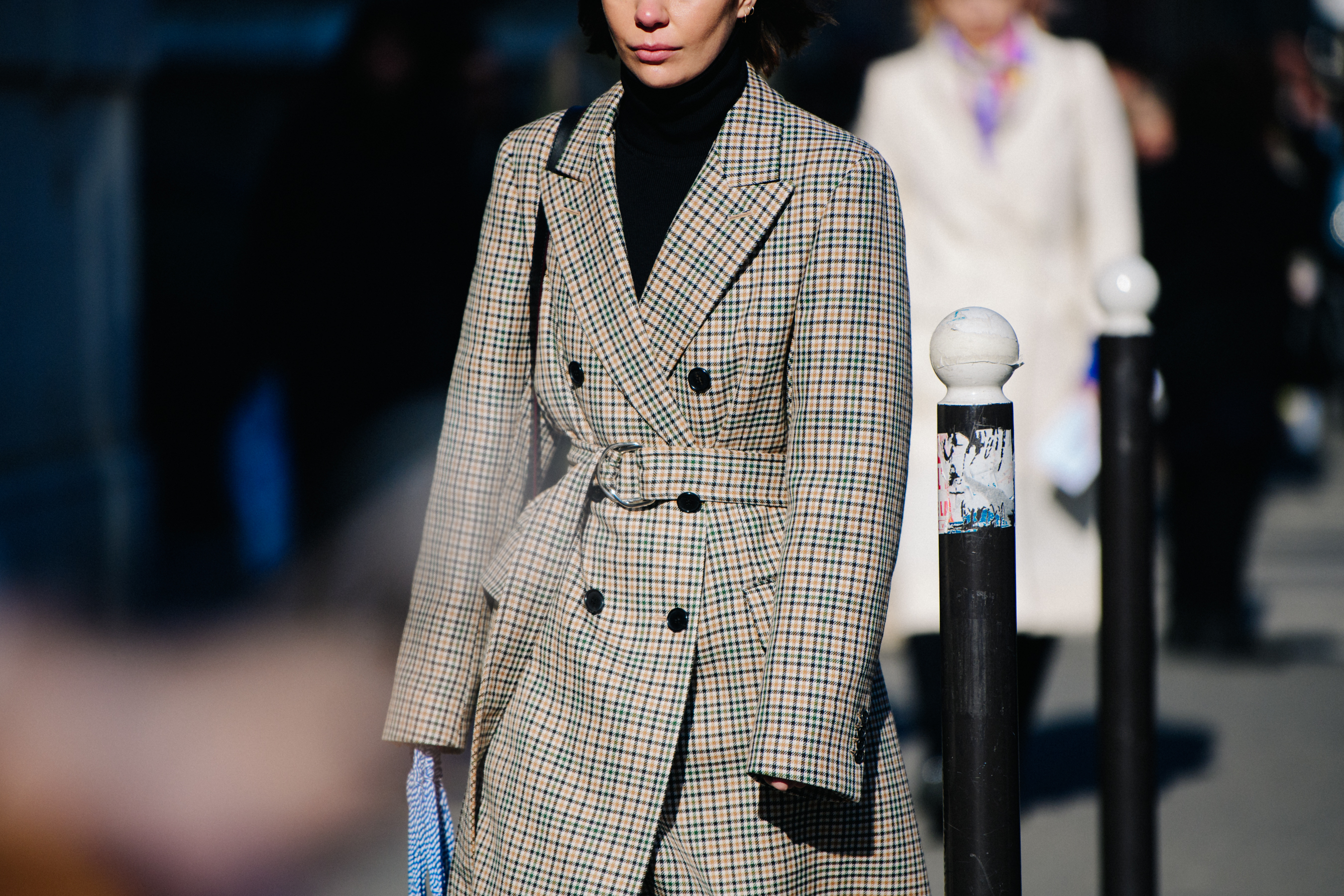Woman wearing check coat