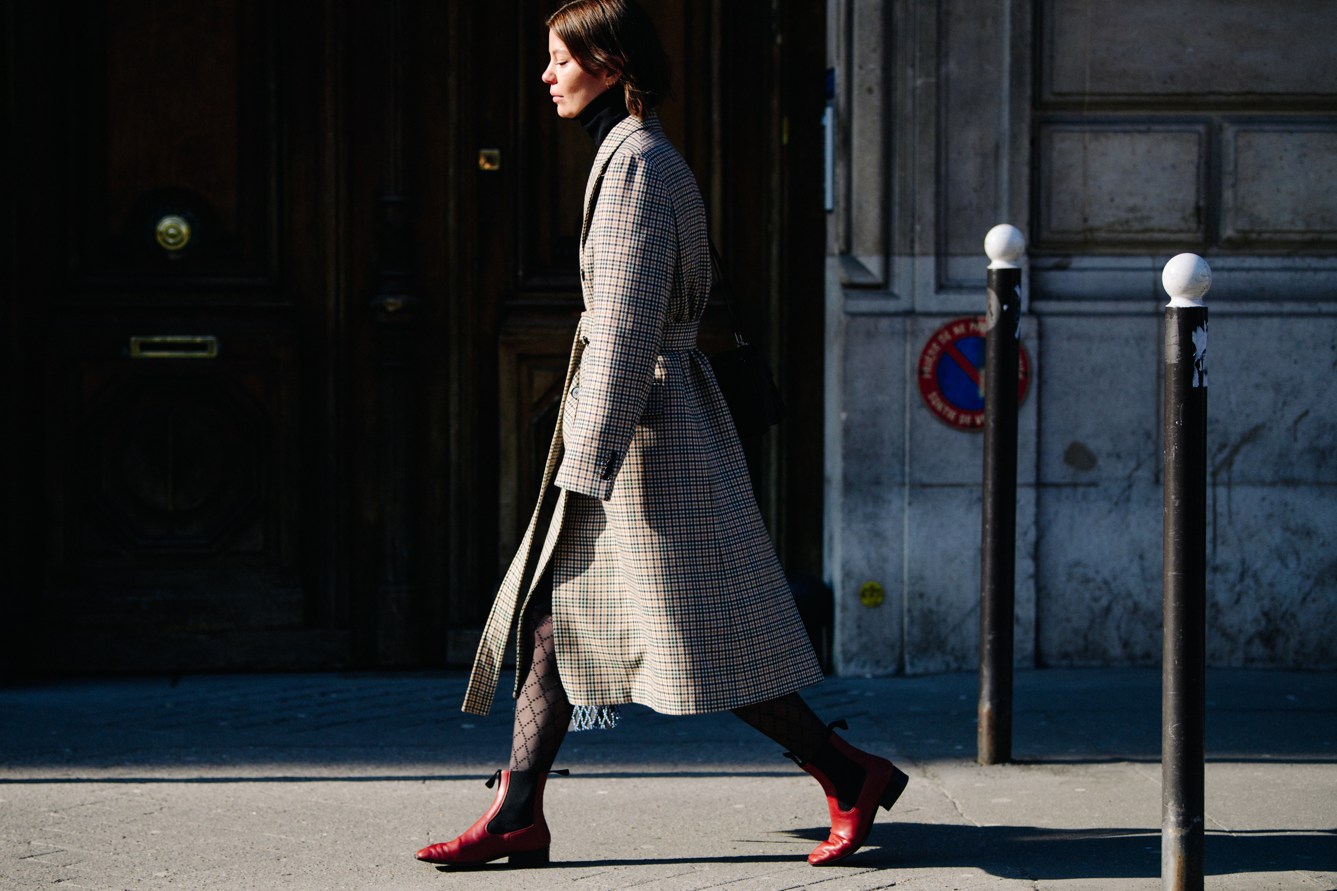 Woman wearing check coat