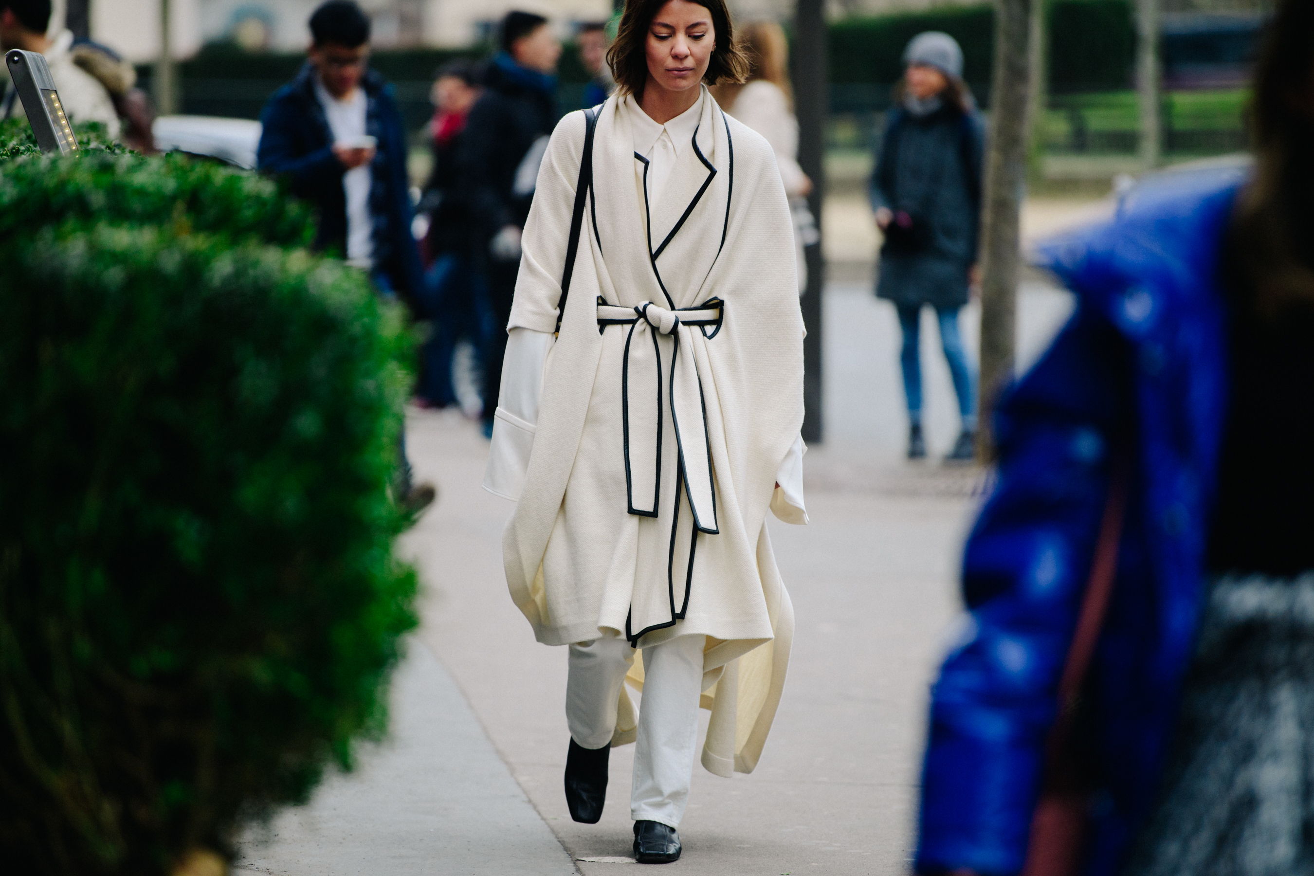 Woman wearing white wool coat