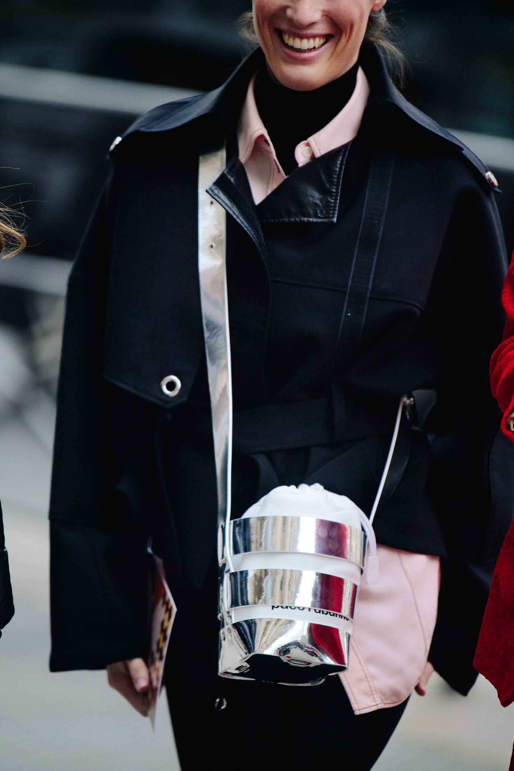 Woman carrying silver Paco Rabanne bag