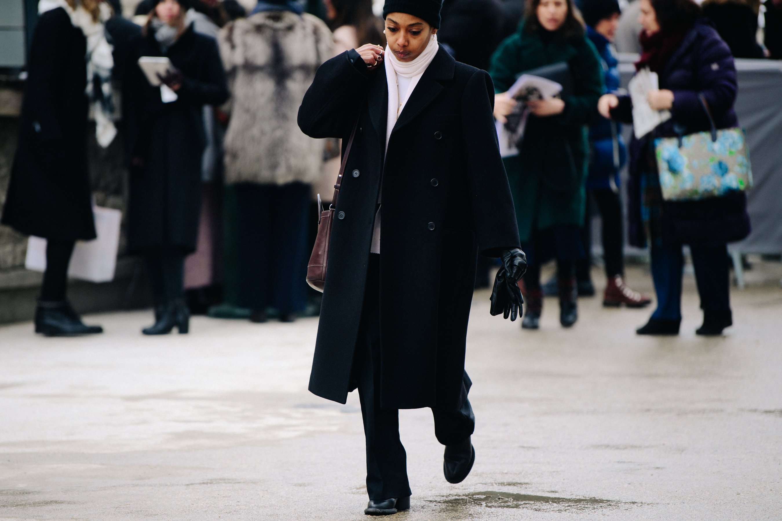 Woman wearing long black coat