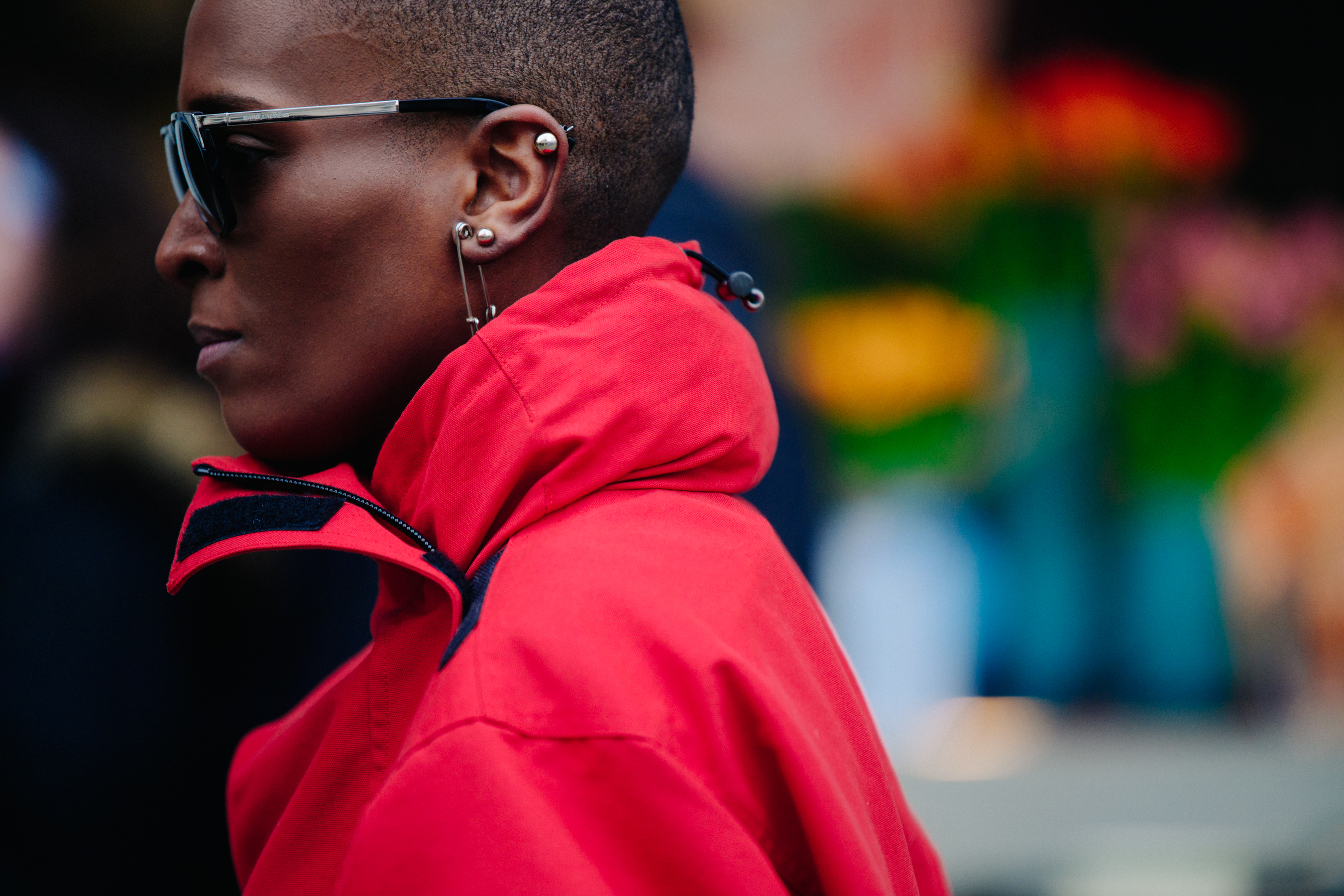 Woman wearing red Balenciaga coat