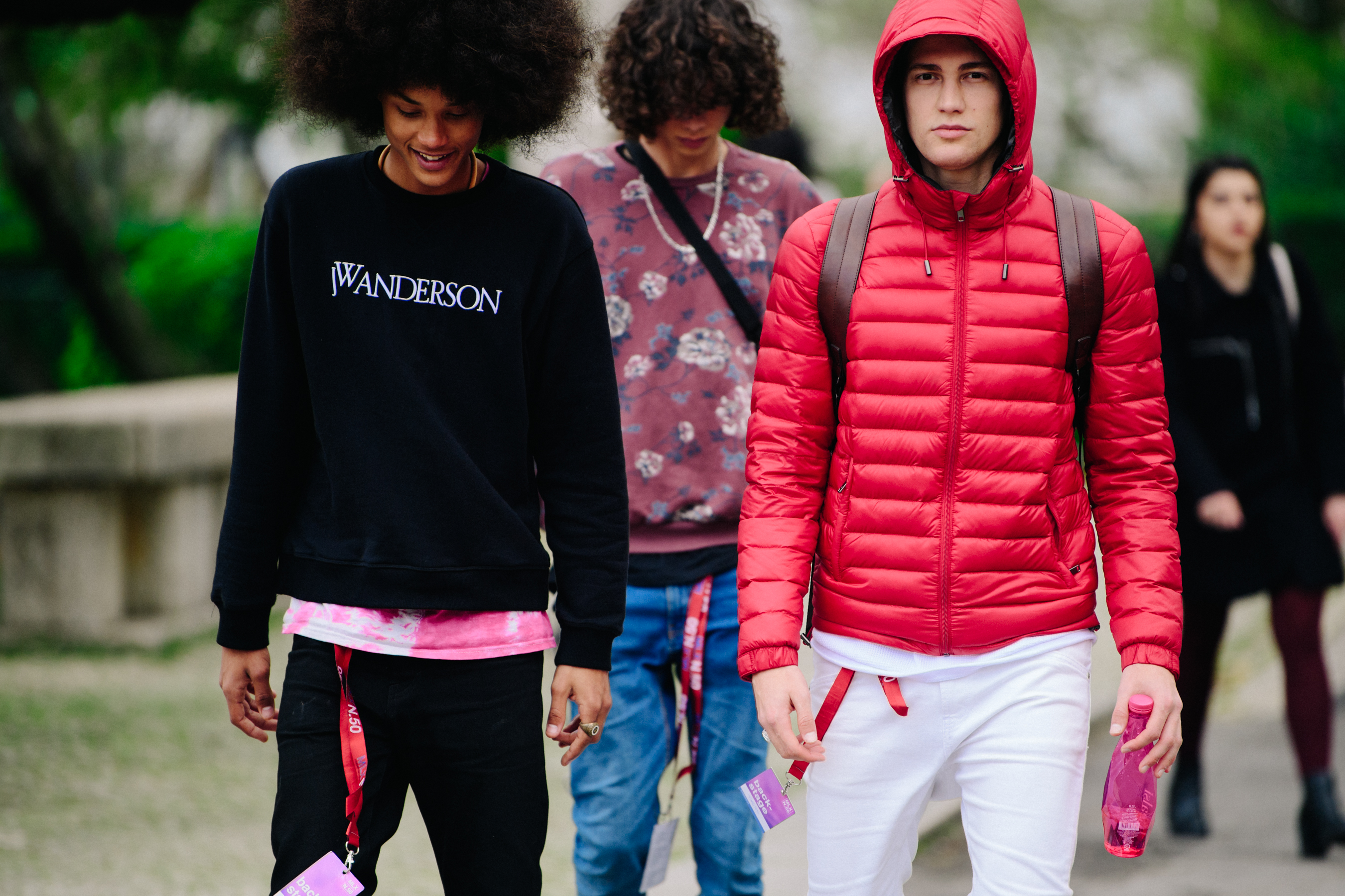 Three male models leaving show