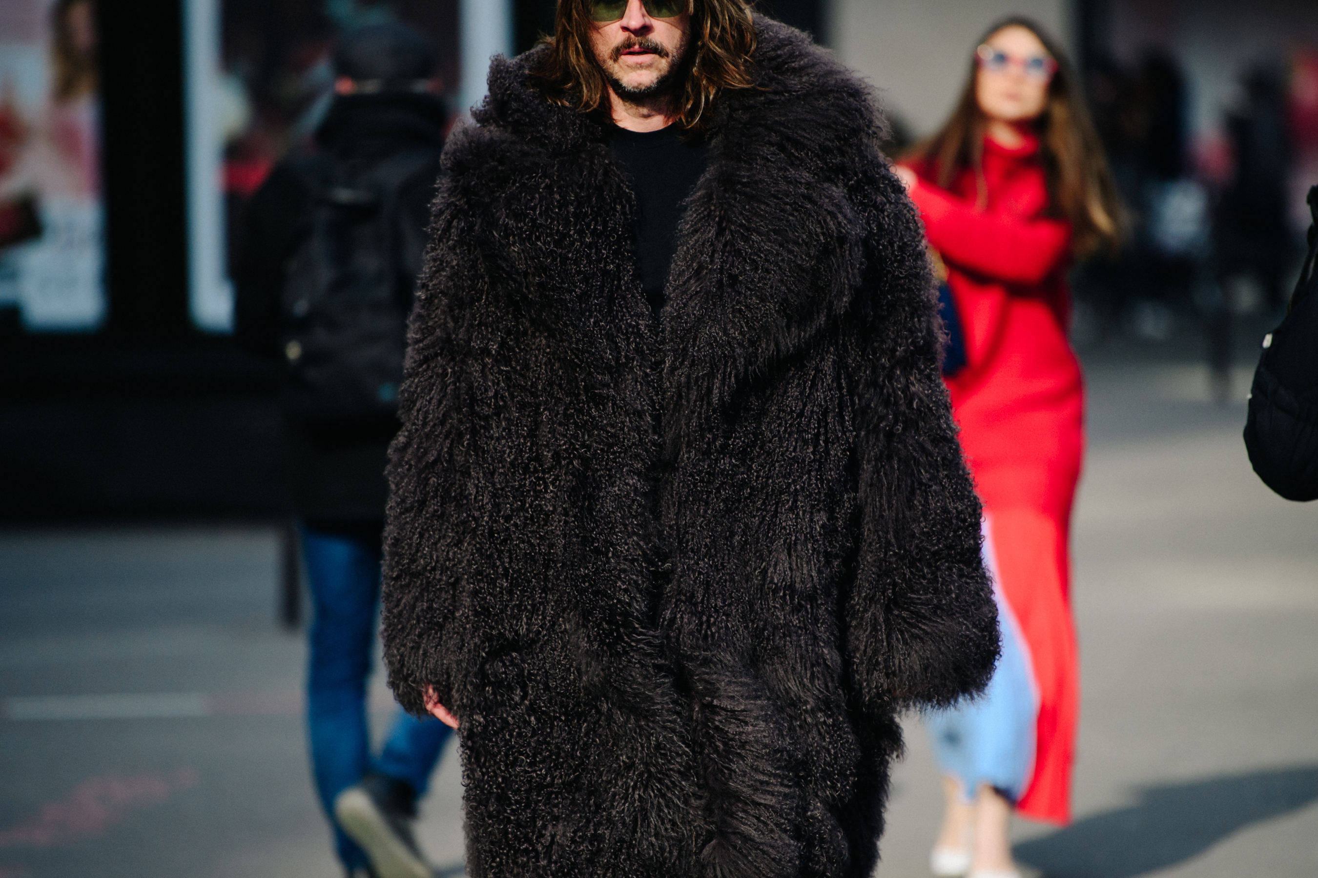 Man wearing huge furry coat