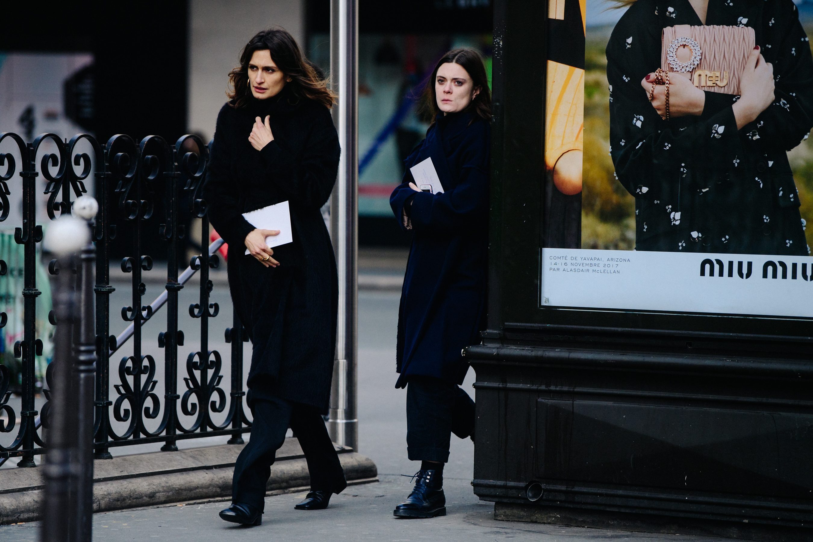 Two women wearing dark wool coats