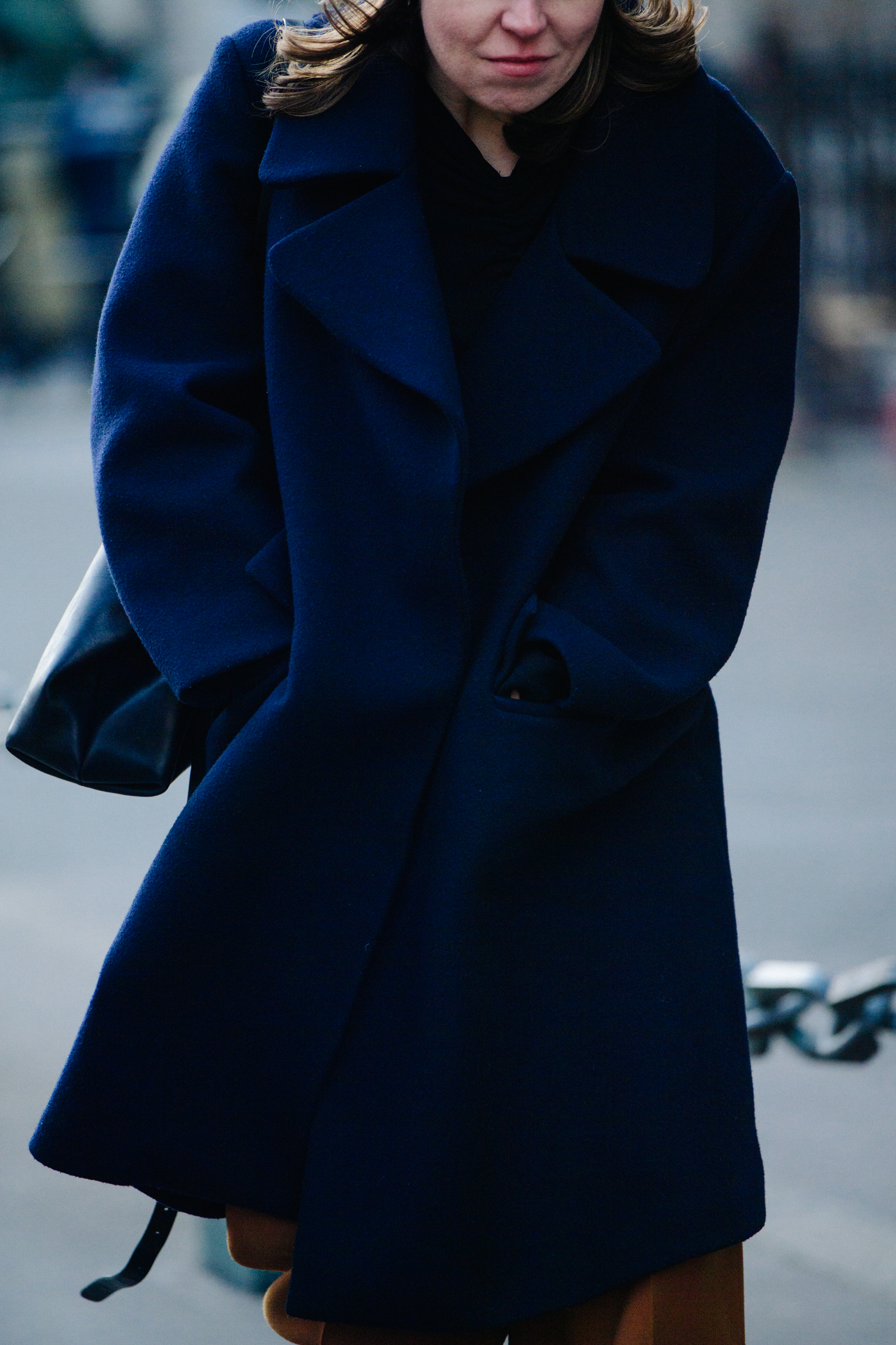 Woman wearing thick blue coat
