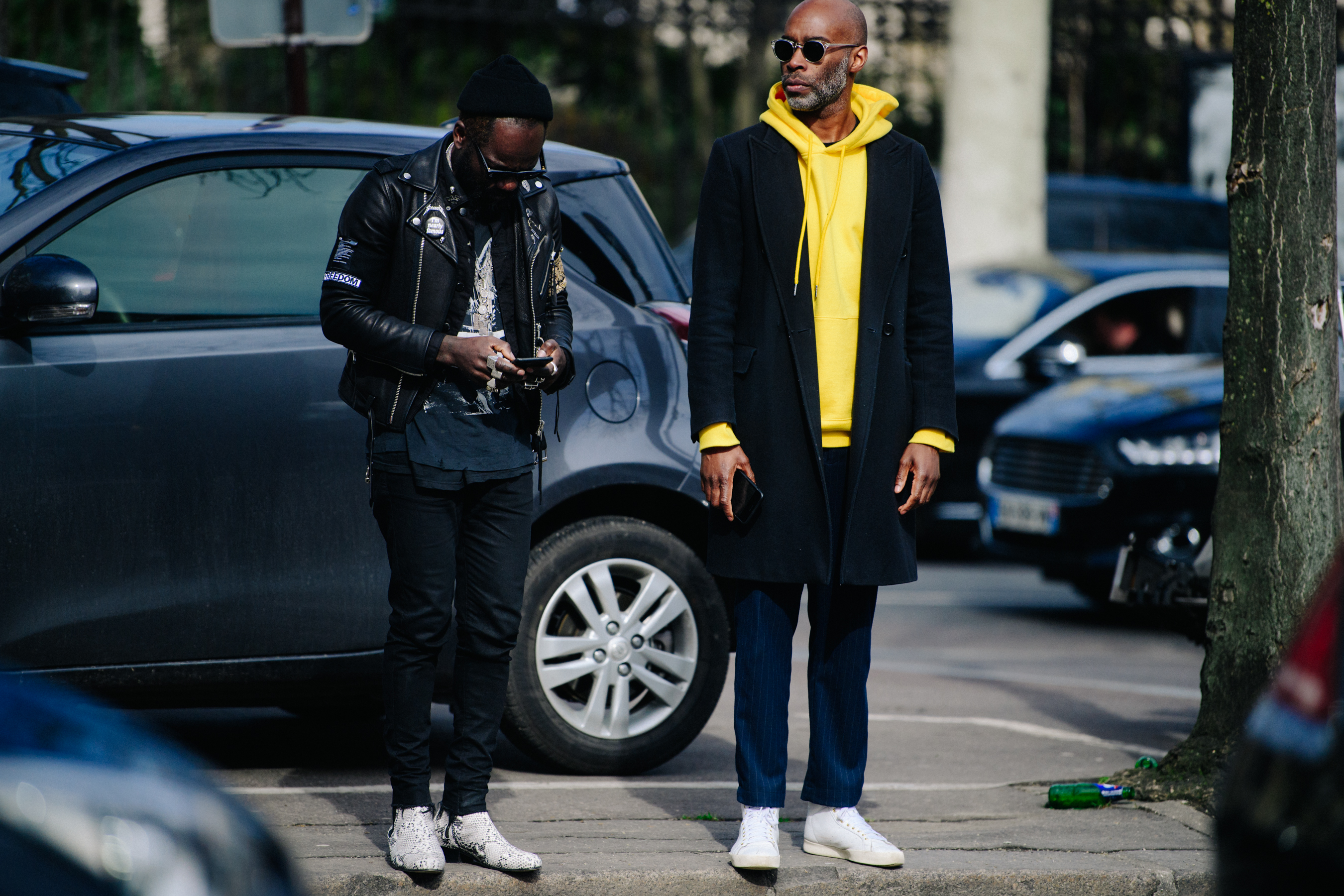 Two men wearing black outfits