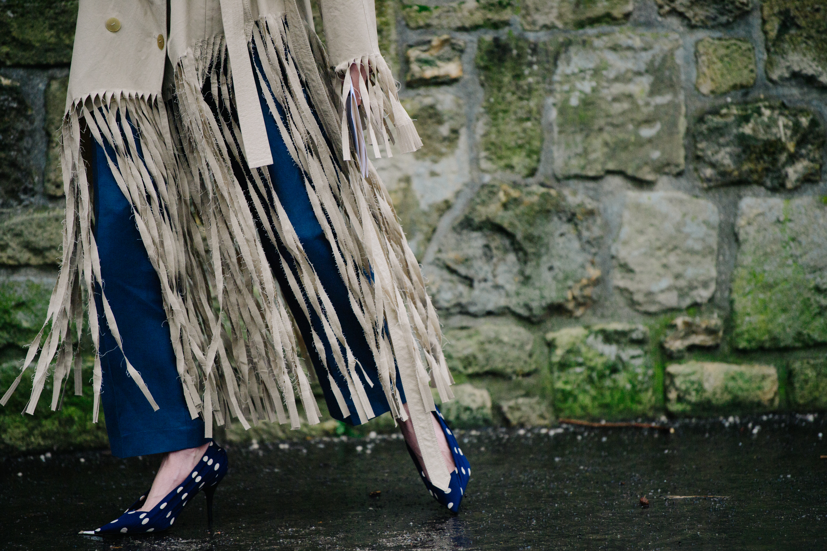Woman wearing blue polka dot heels