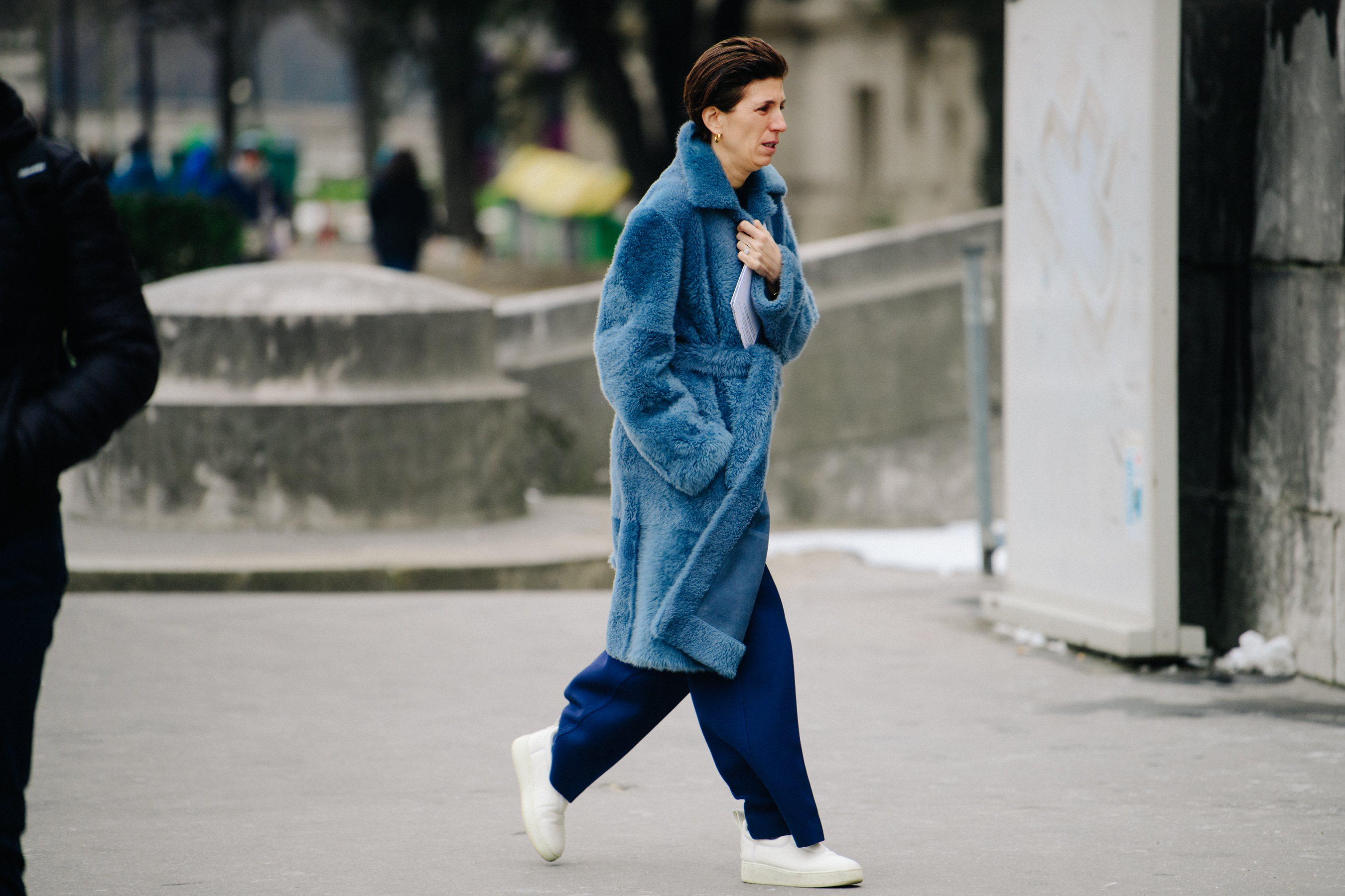 Woman wearing long blue coat