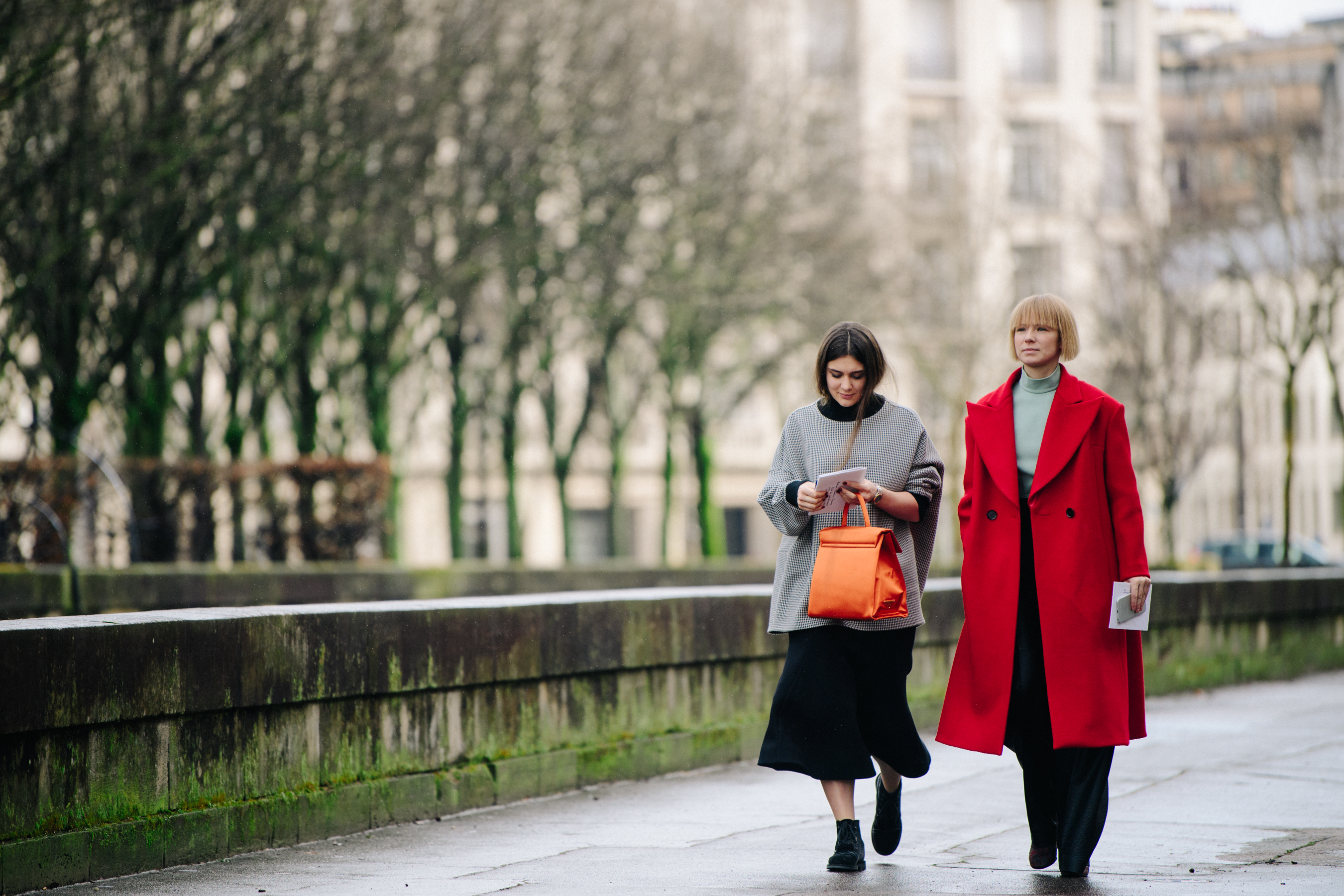 Two women wearing long thick outfits