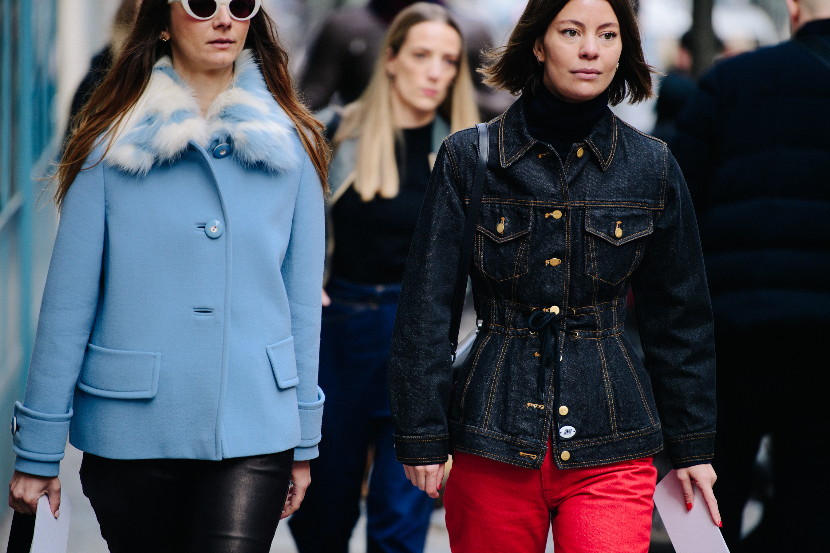 Two women wearing light jackets