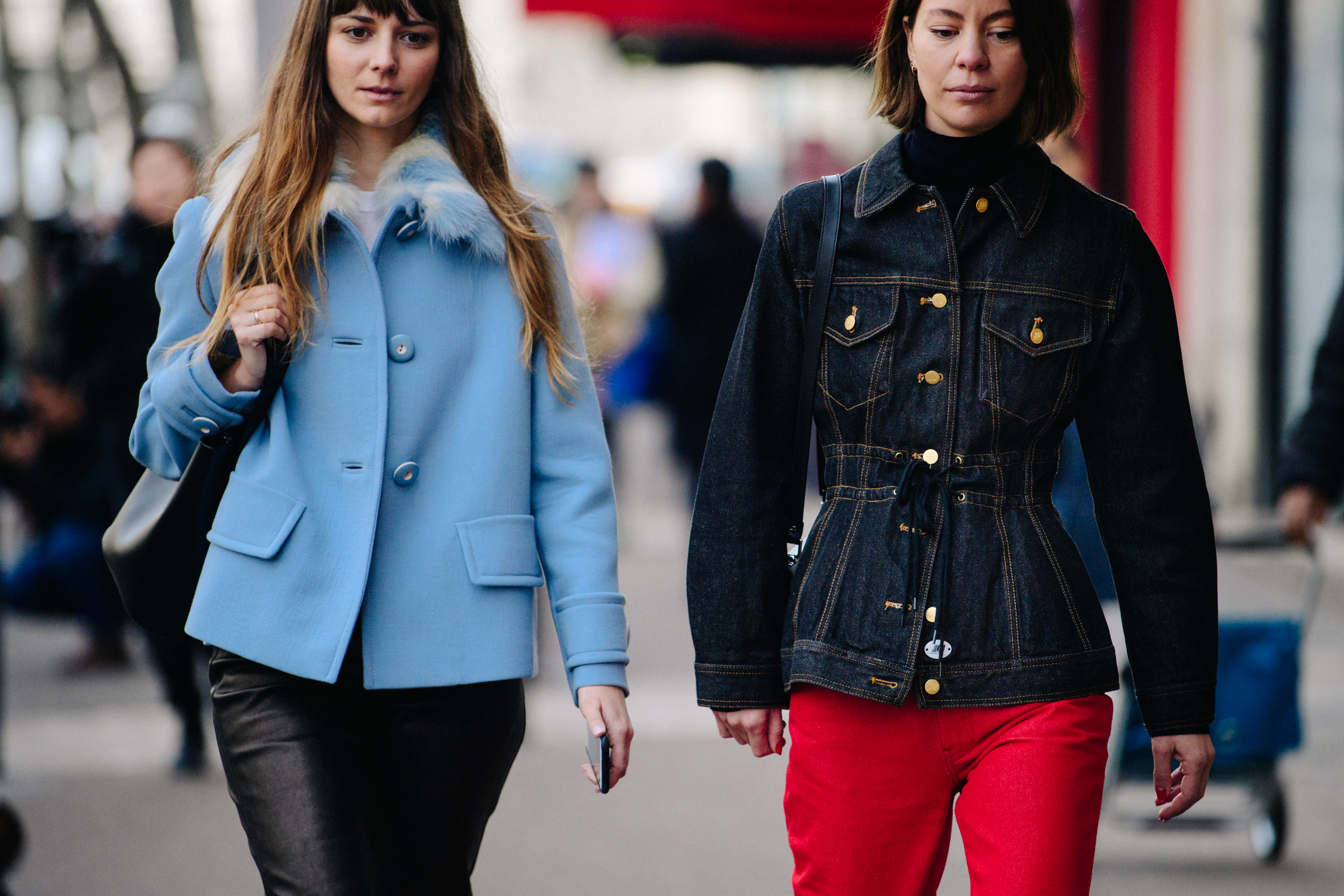 Two women wearing light jackets
