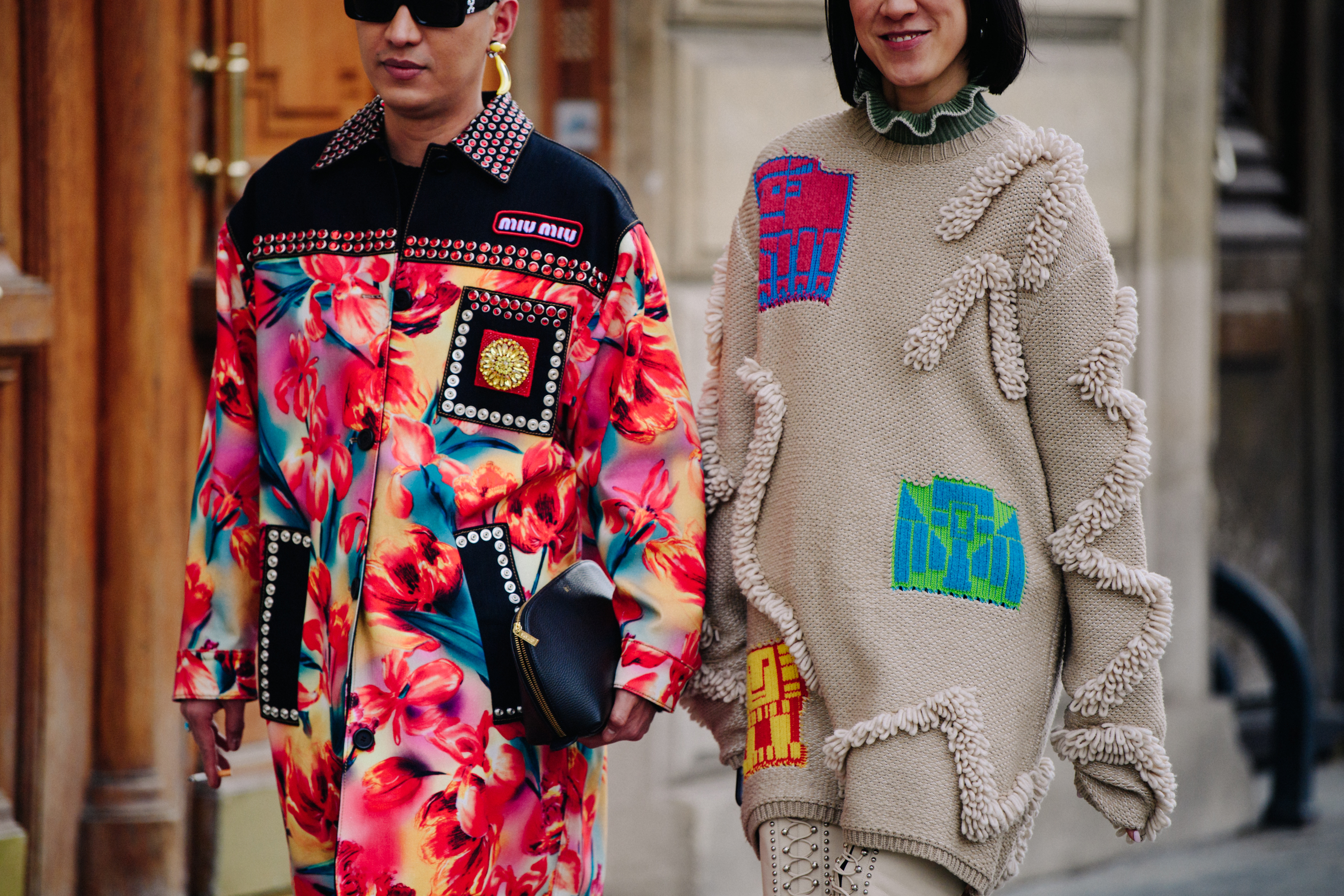 Asian couple wearing Miu Miu outfits