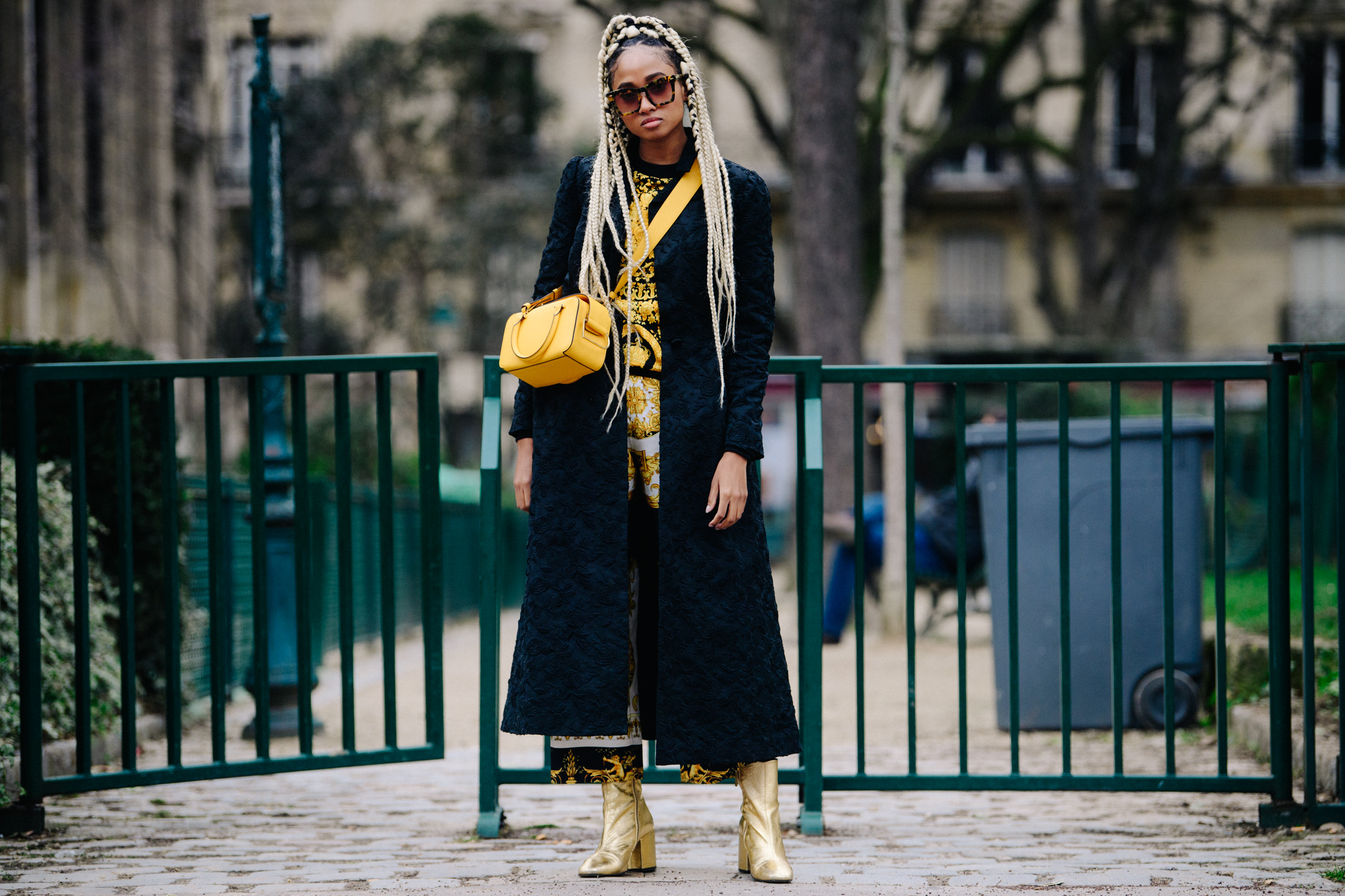 American woman wearing gold boots