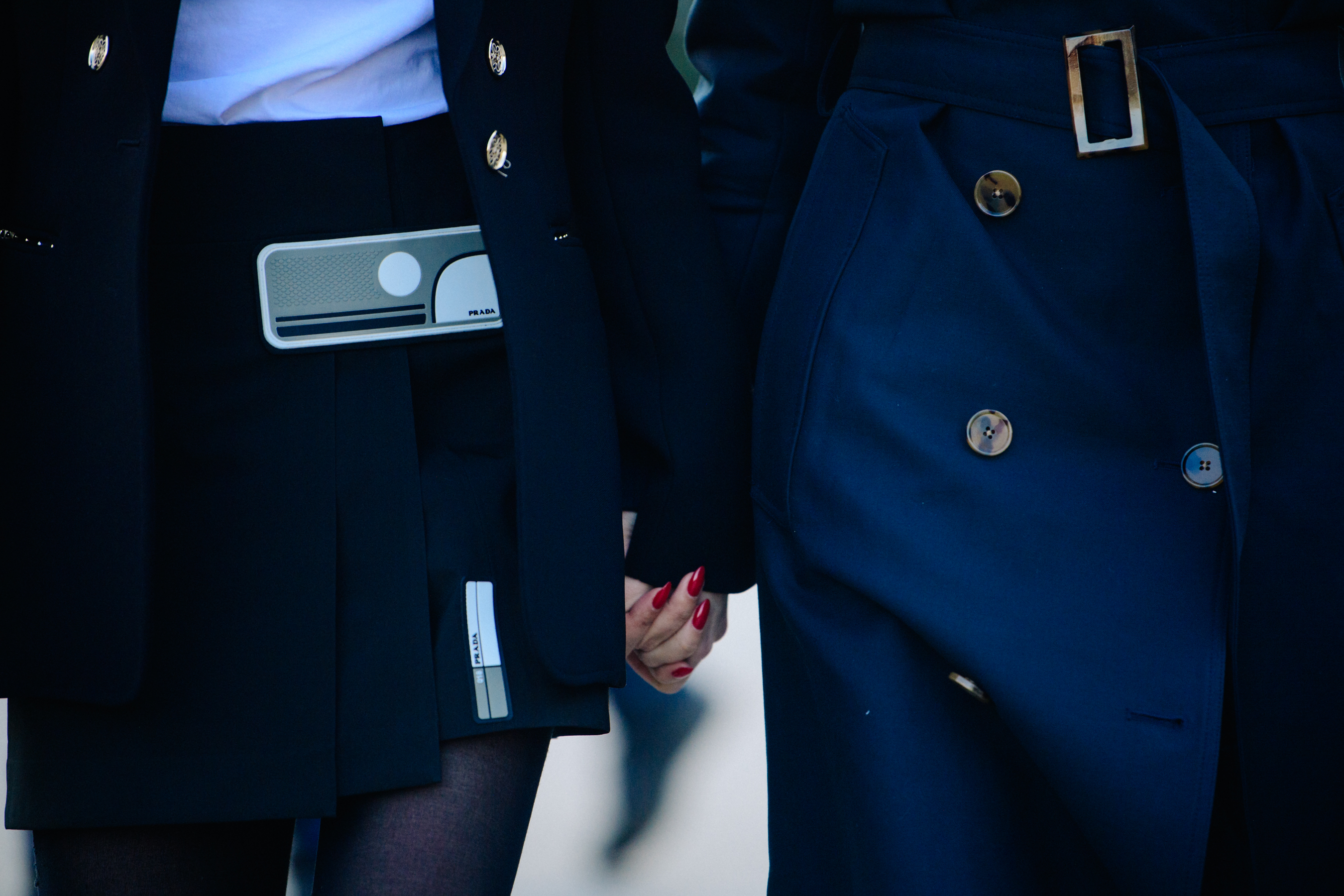 Two bloggers wearing dark coats