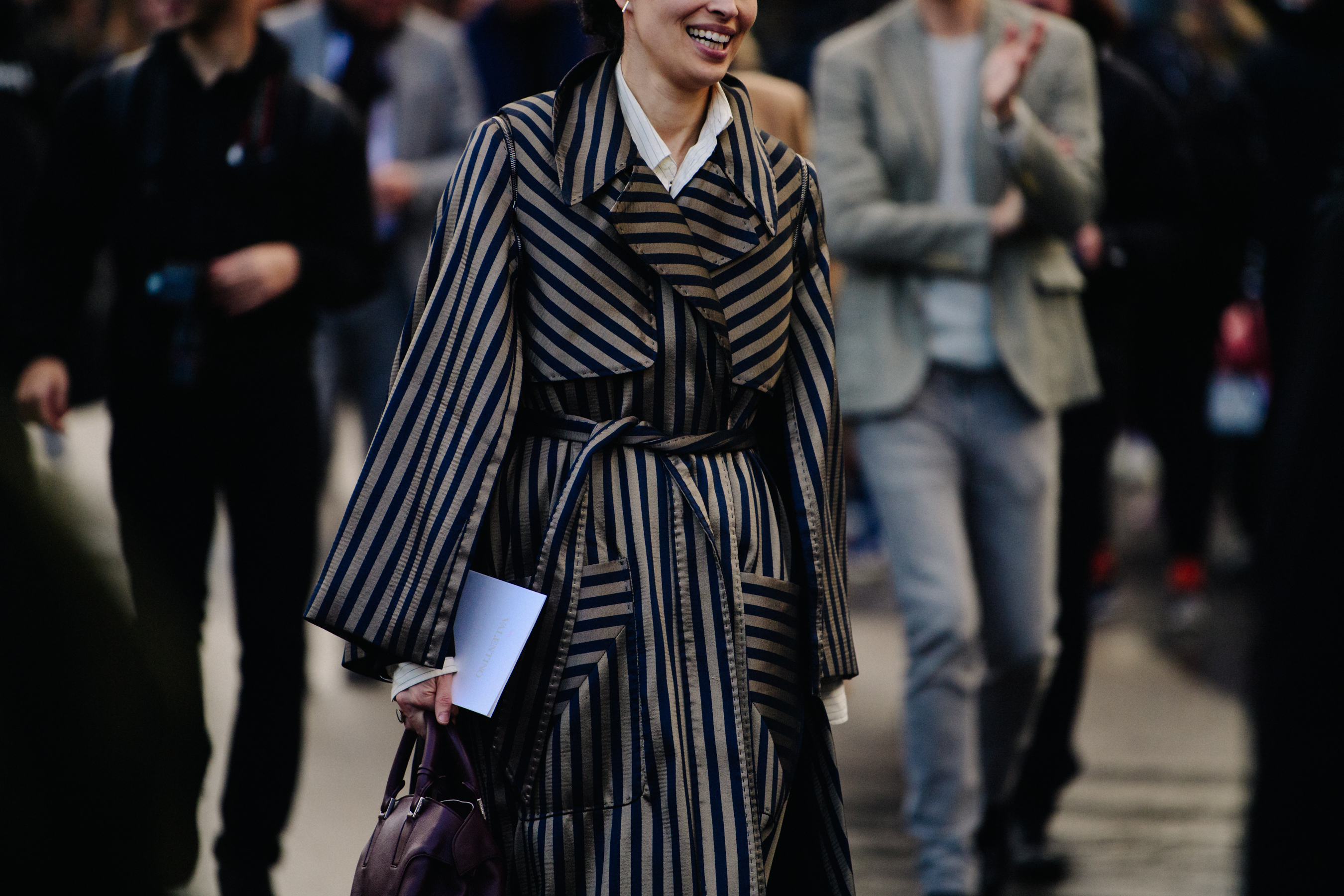 Woman wearing gold striped coat