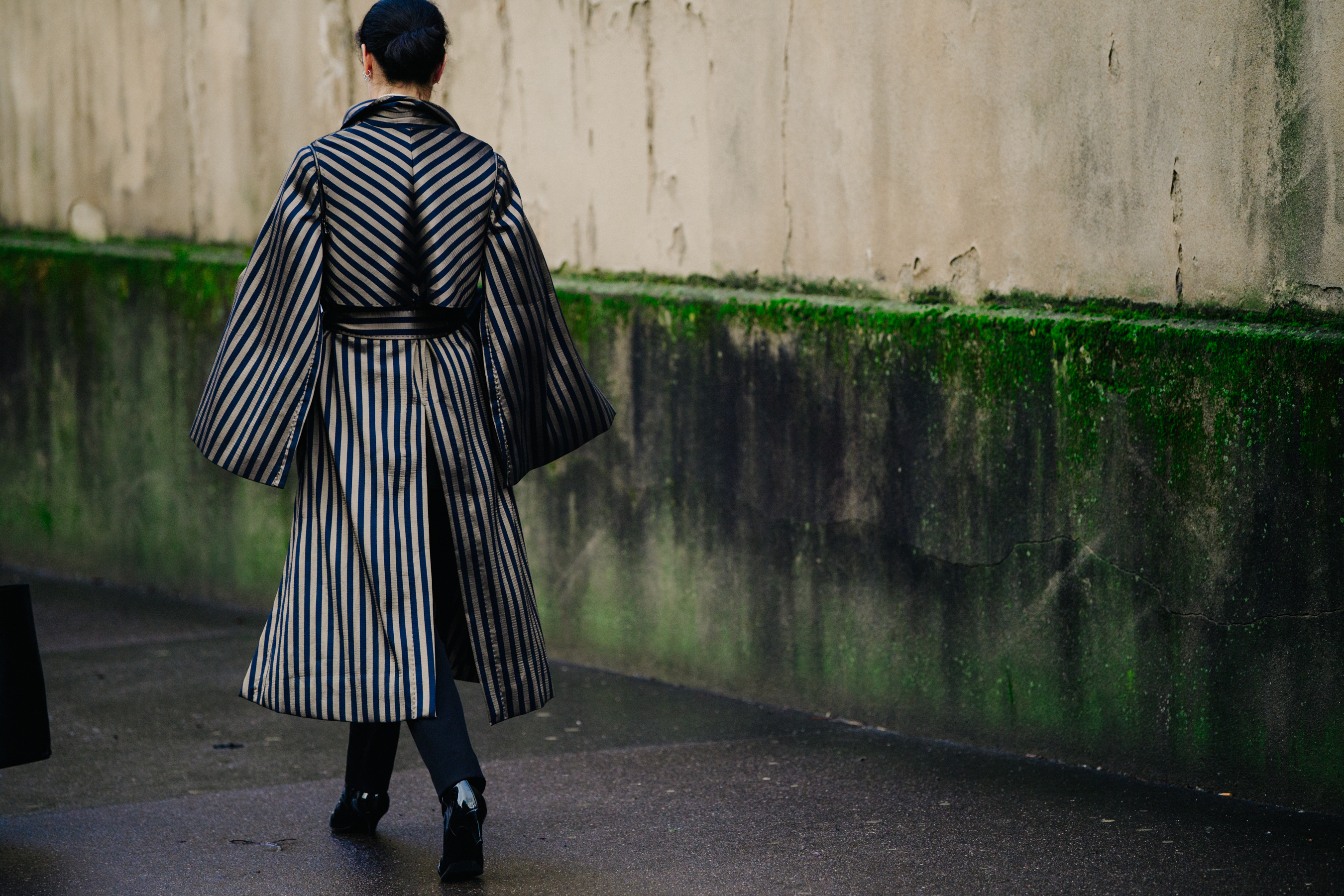 Woman wearing gold striped coat