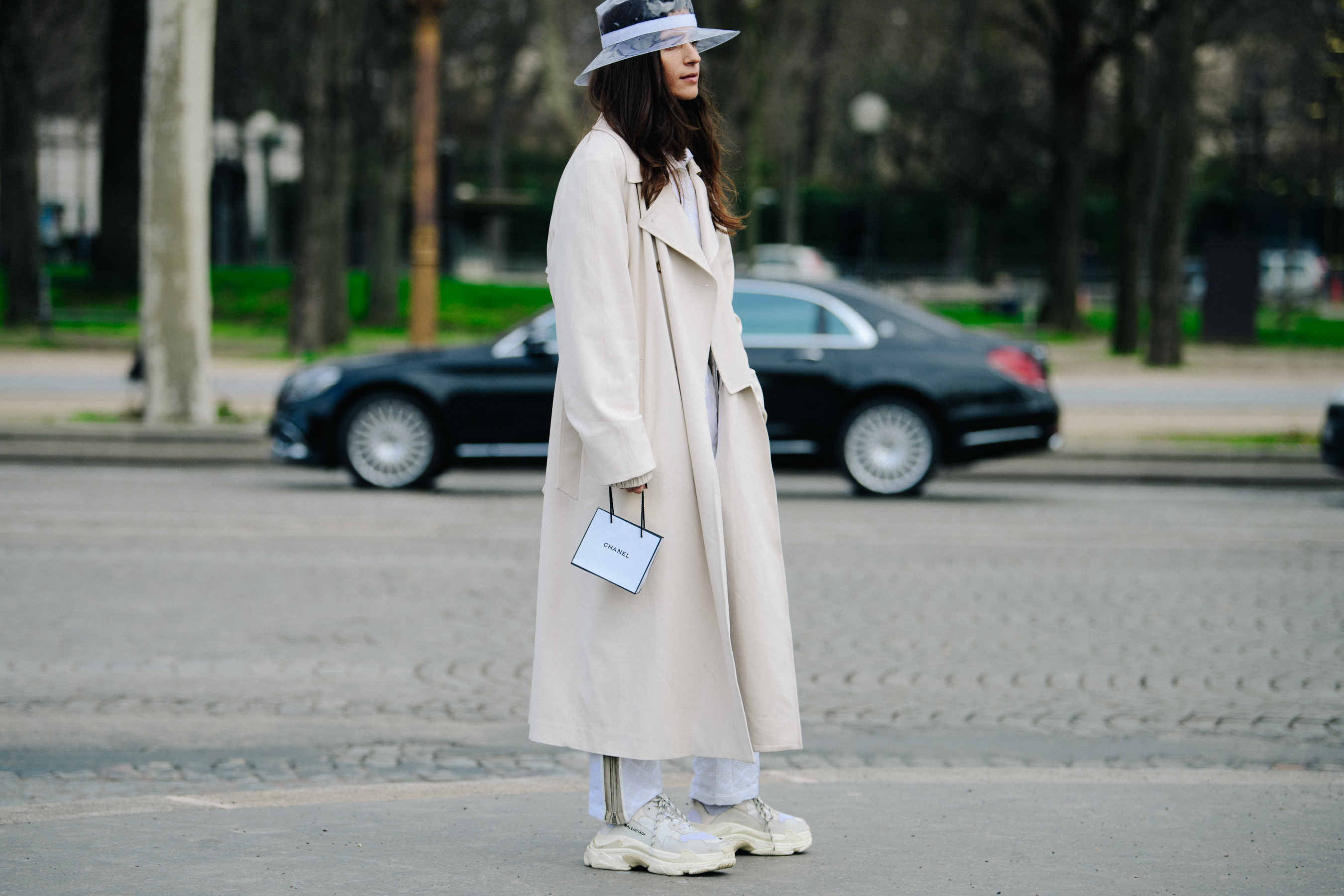 Woman wearing long white coat