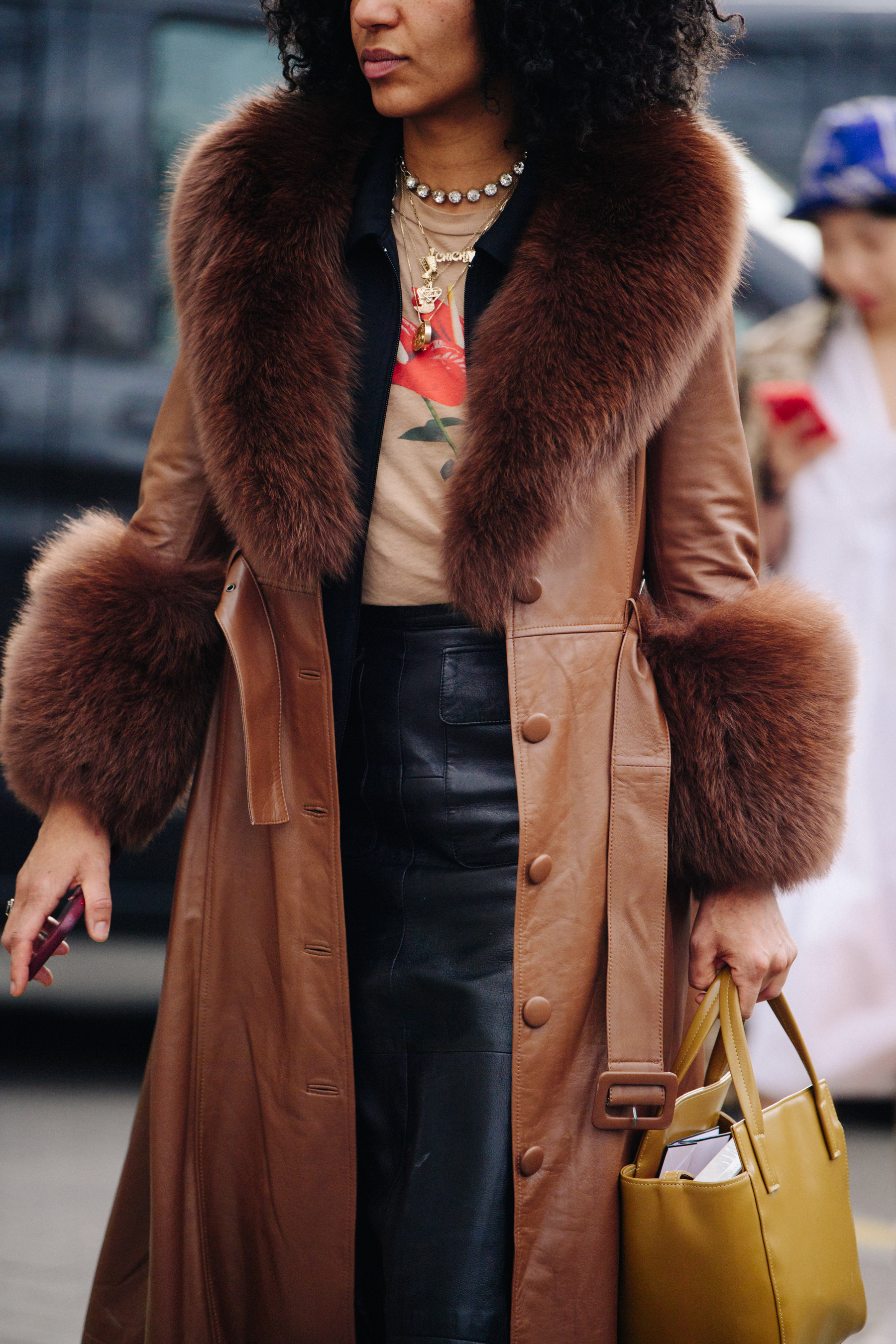 Woman wearing brown fur trim coat
