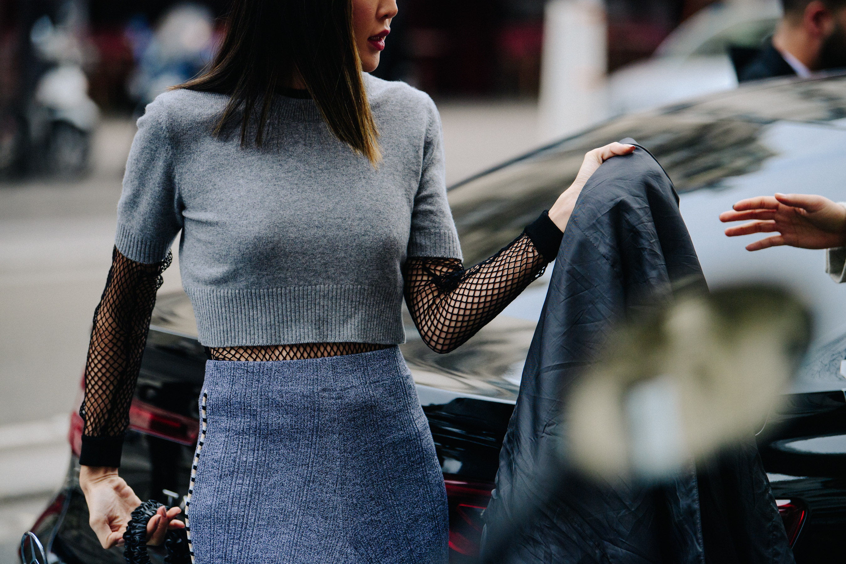 Asian woman wearing grey cropped knit